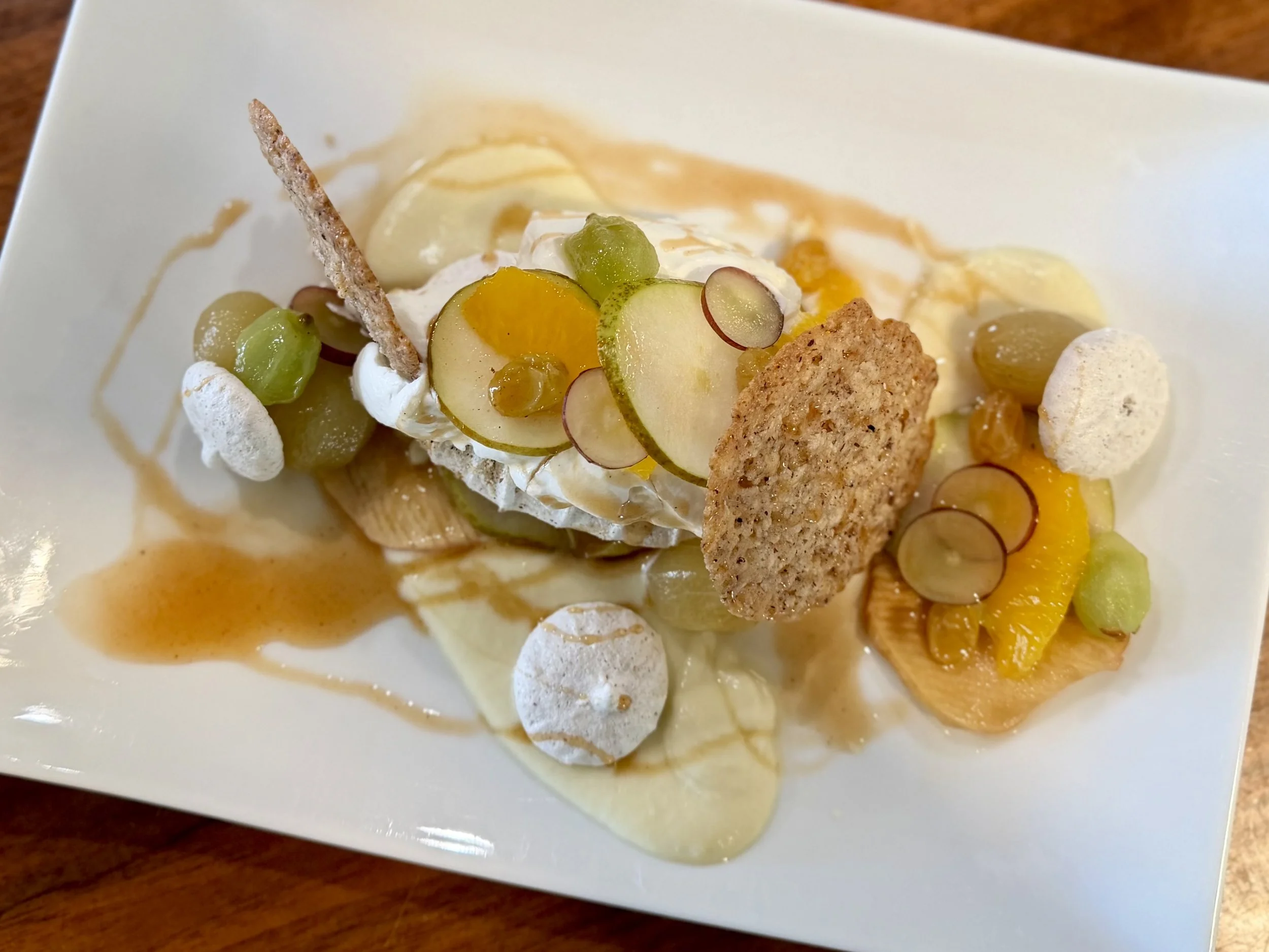 Hazelnut Pavlova, grapes, apple, golden raisins, apple cider