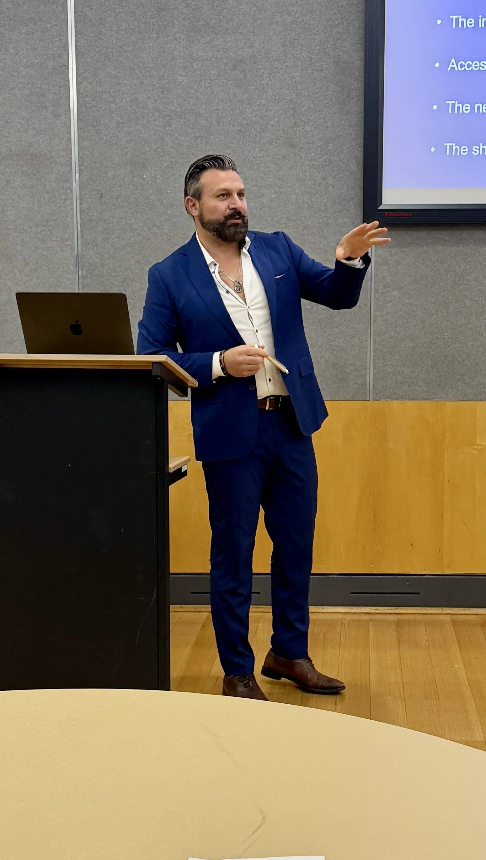 Dr Ozgur Yalcin - Delivering a talk in adhd and trauma.JPG