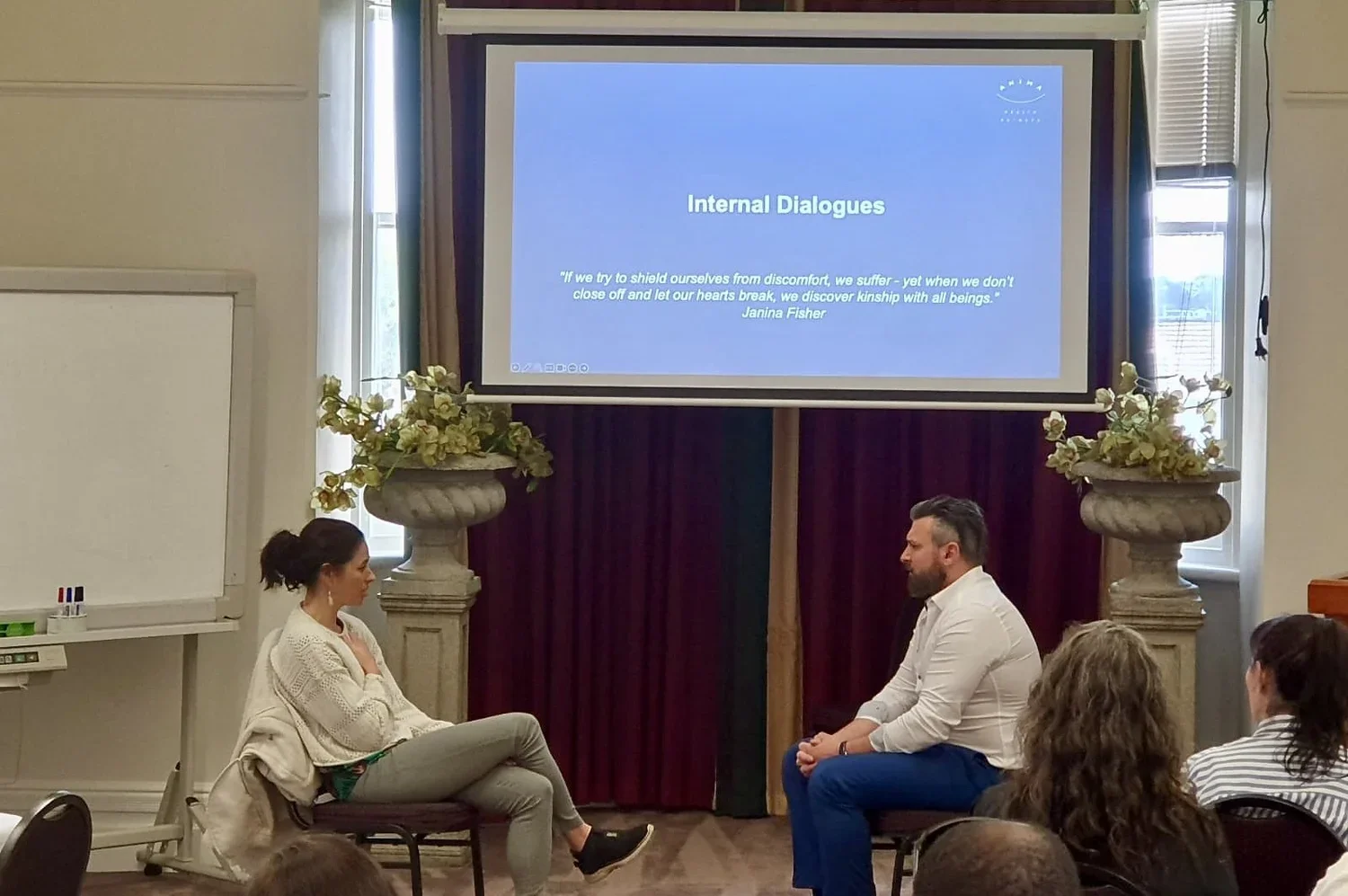 Clinical Psychologist Dr Ozgur Oz Yalcin conducting a live, unscripted chairwork psychotherapy demonstration with a participant during an advanced mental health training workshop for clinicians.