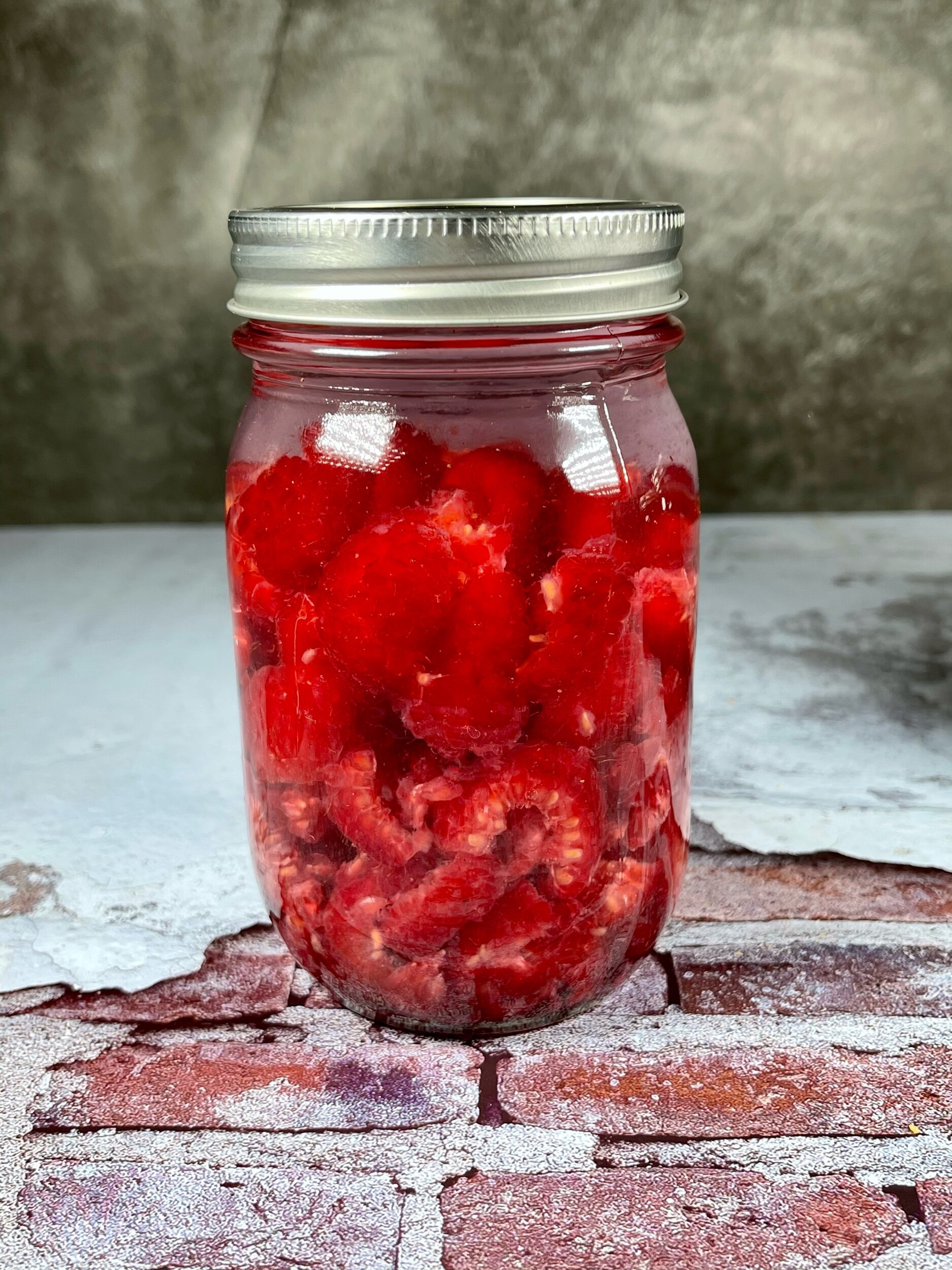  Chopped raspberries back in their jar and vodka added,making sure they are all submerged. 
