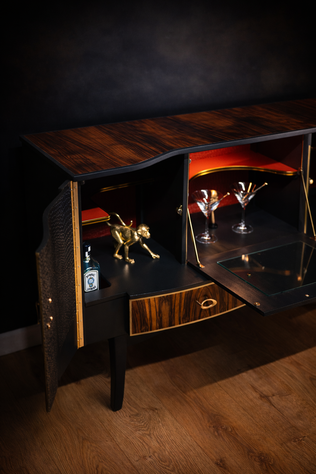 cocktail cabinet with red interior and glassware storage space