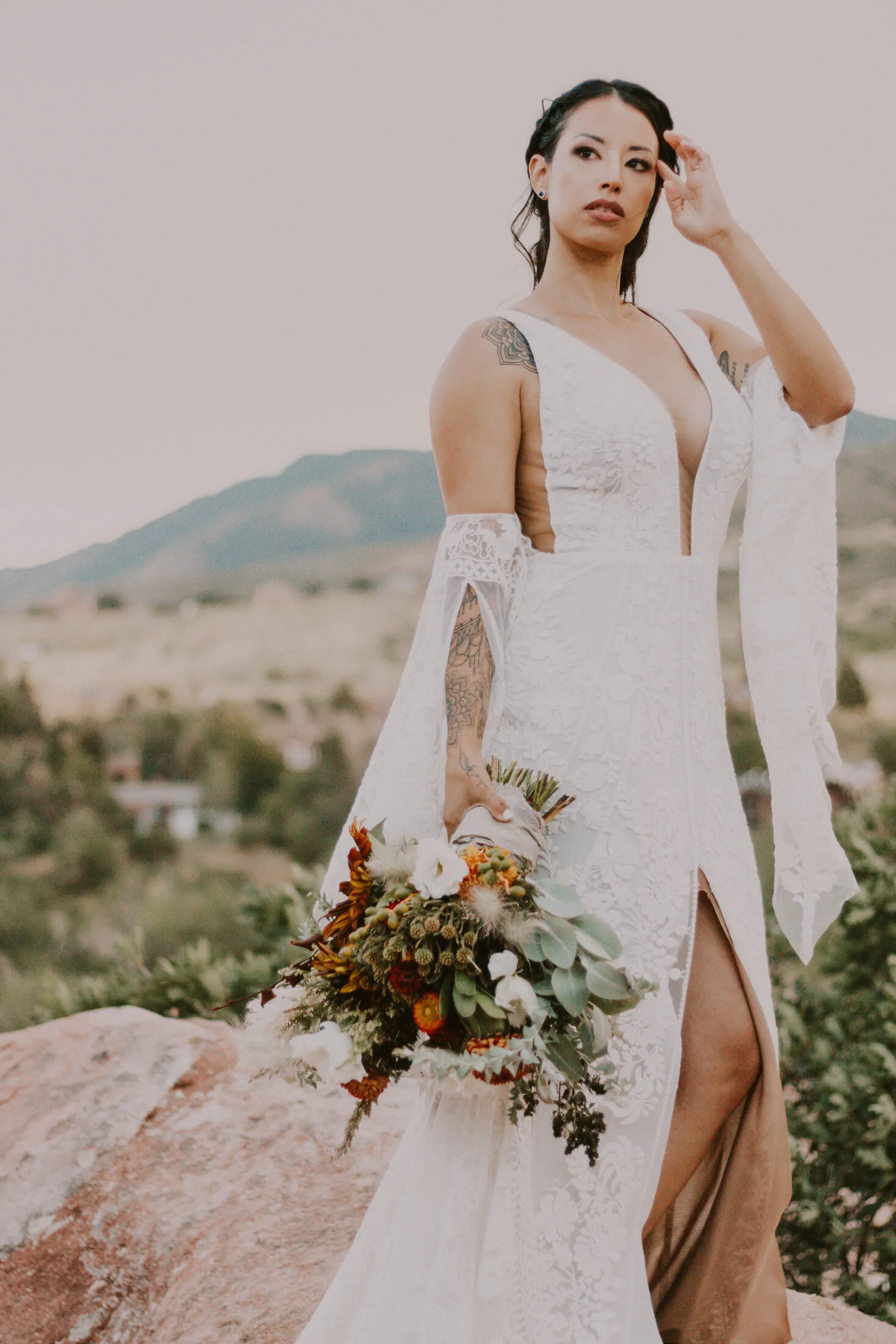  This Denver, Colorado bride, photographed by Dawn Louise Photography highlights bohemian wedding style. unruly orange and white wedding bouquet, bohemiadn wedding bouquet, colorado red rock bridal session, colorado red rock wedding ceremony, profess