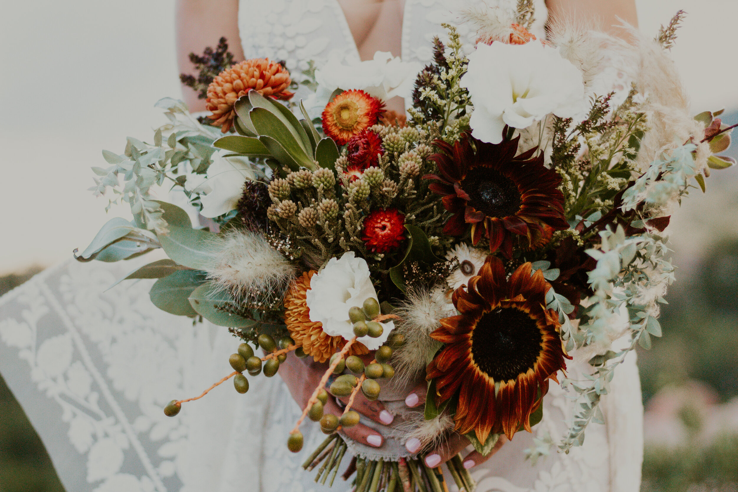  Highlighting wedding day details, Denver, Colorado’s Dawn Louise Photography features bohemian bride’s unruly white and burnt orange colored bridal bouquet. orange and white wedding bouquet, bohemian bridal bouquet, bohemian bride, professional denv