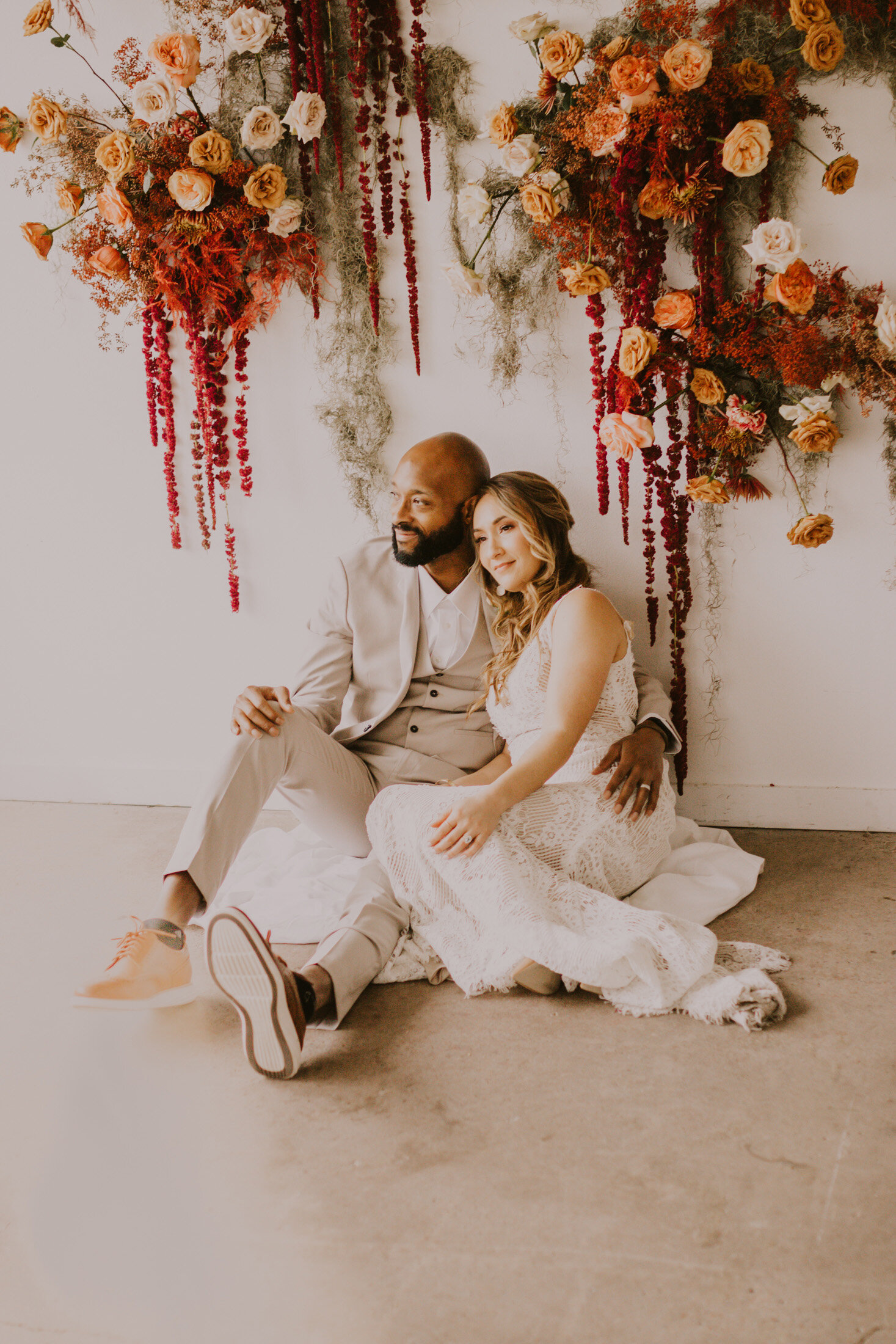  A beautiful couple smiles for the camera during a boho inspired styled wedding shoot in Boulder, Colorado with Dawn Louise Photography. Smiles for the camera bridal hair inspo denver wedding photographer styled shoot bohemian wedding inspo floral ba