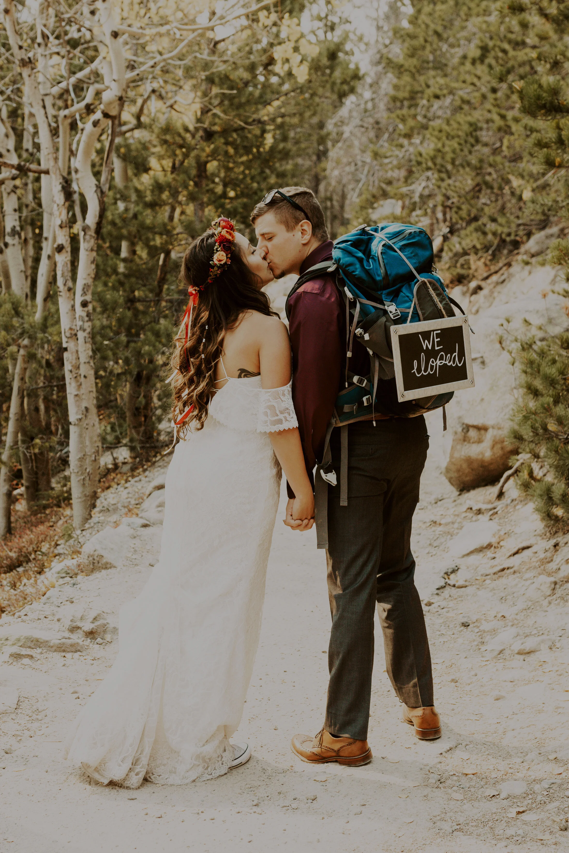  A stunning couple elopes in the mountains of Colorado with Dawn Louise Photography. cost of elopement small weddings intimate ceremony adventure wedding bride and groom mountain wedding lifestyle outdoor wedding day denver wedding photographer #elop