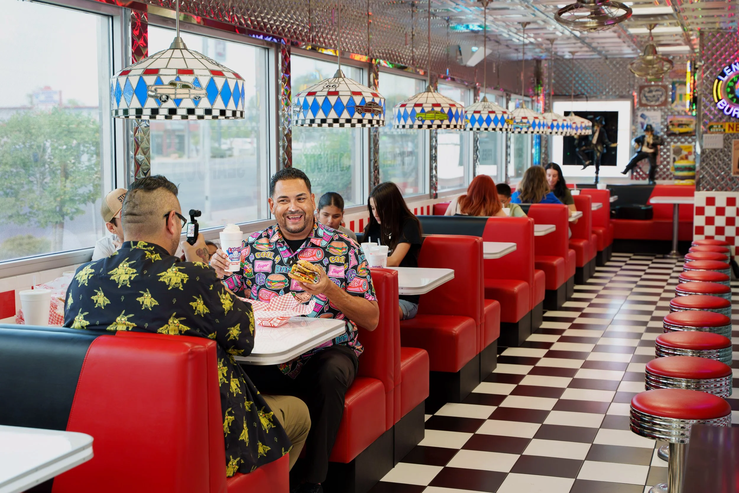 Customers dining inside the retro interior of Lenny's Burger in Phoenix Arizona