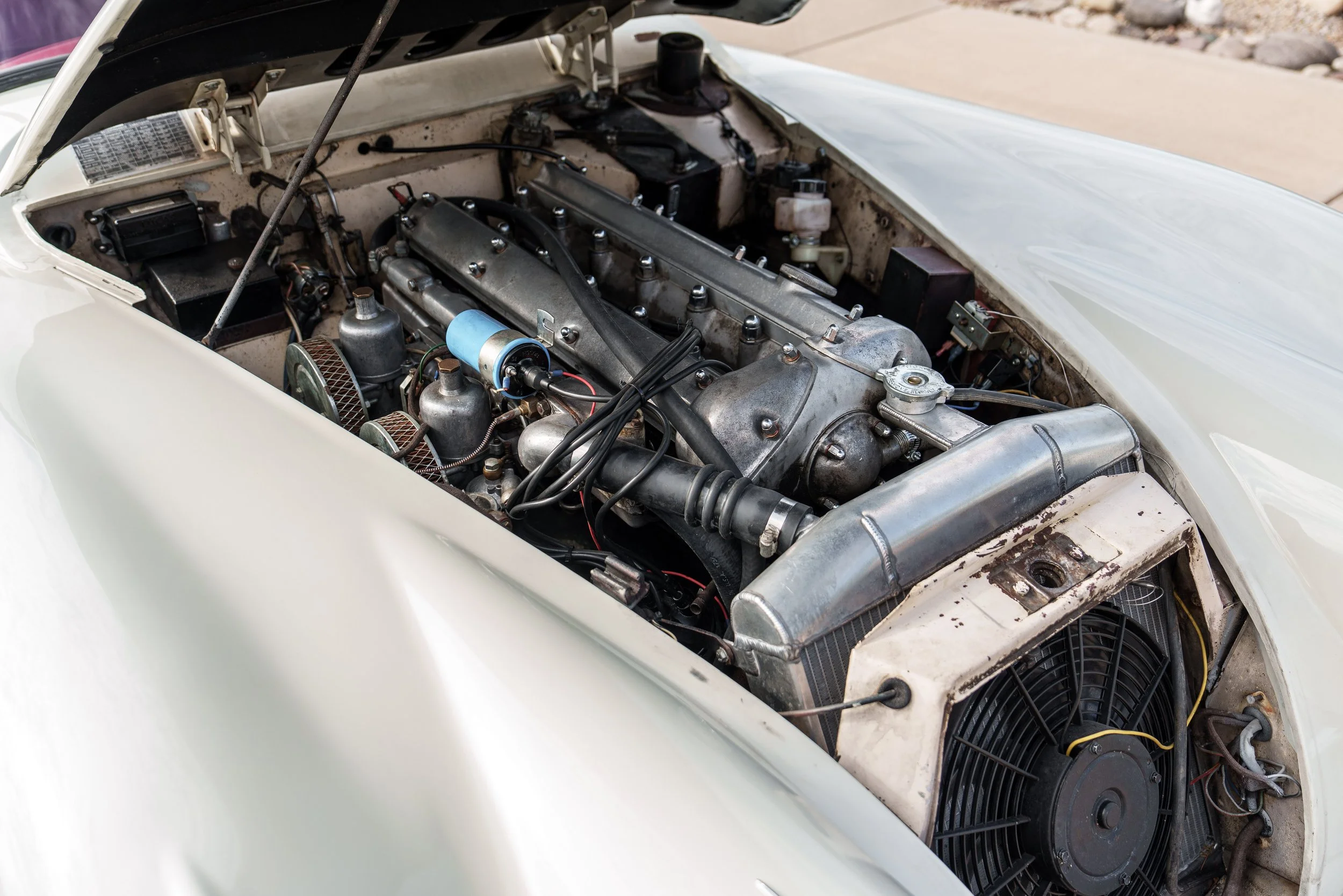 Engine compartment of a 1960 Jaguar XK150 with a 3.8-liter inline-six