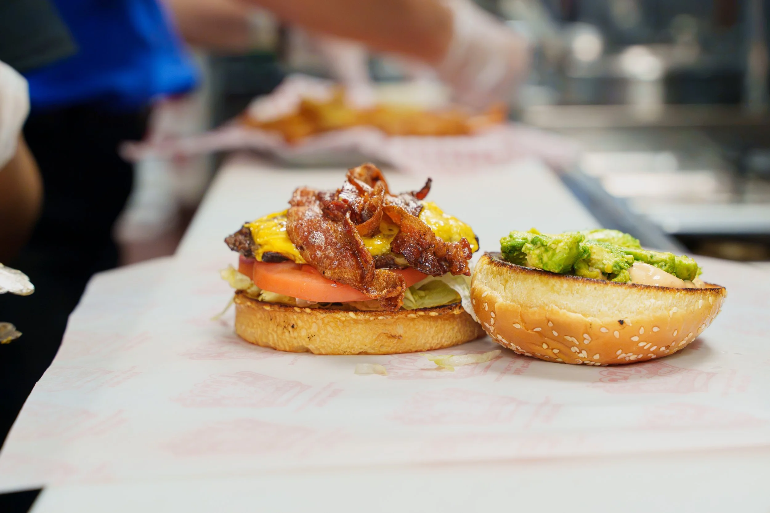 Bacon cheeseburger being prepared inside the kitchen at Lenny's Burger in Phoenix