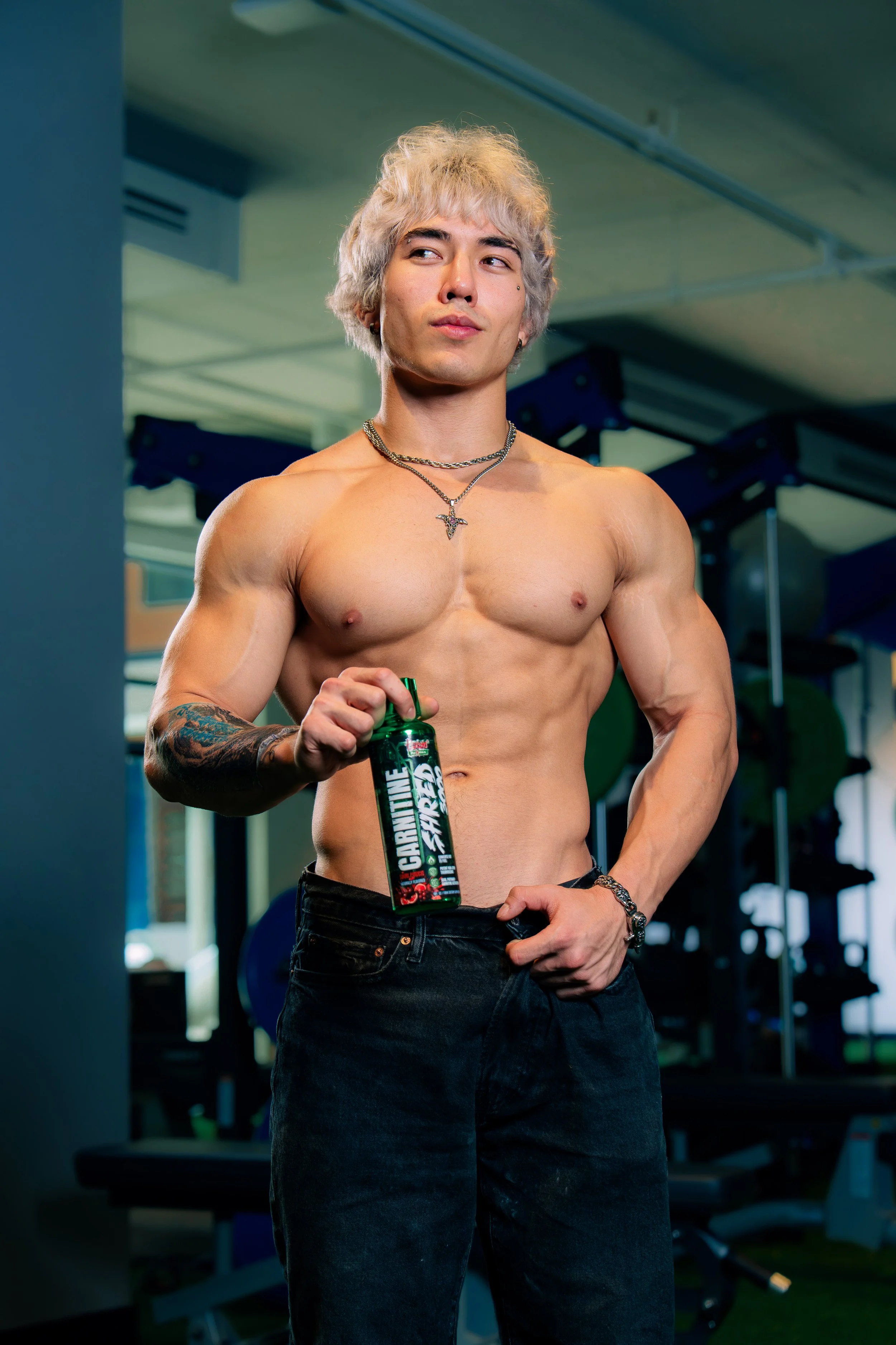 Male fitness athlete holding a Psycho Pharma supplement during a Phoenix advertising photoshoot
