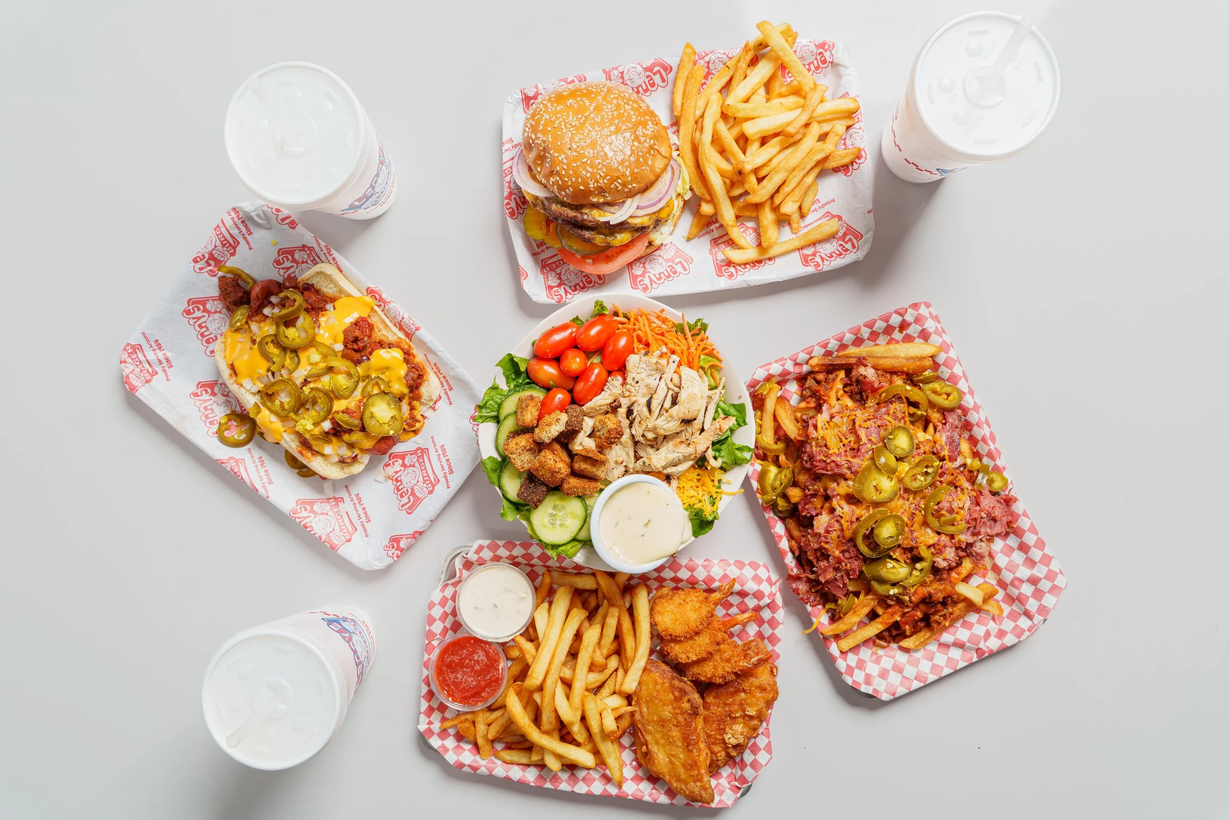 Overhead restaurant menu photography featuring several Lenny's Burger dishes in Phoenix