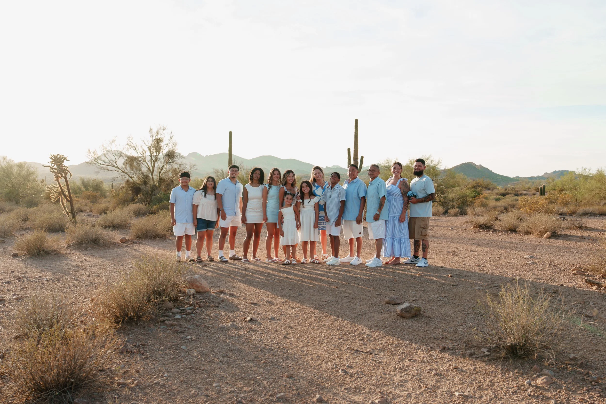 Extended family photographed at sunset in the Arizona desert near Lost Dutchman State Park