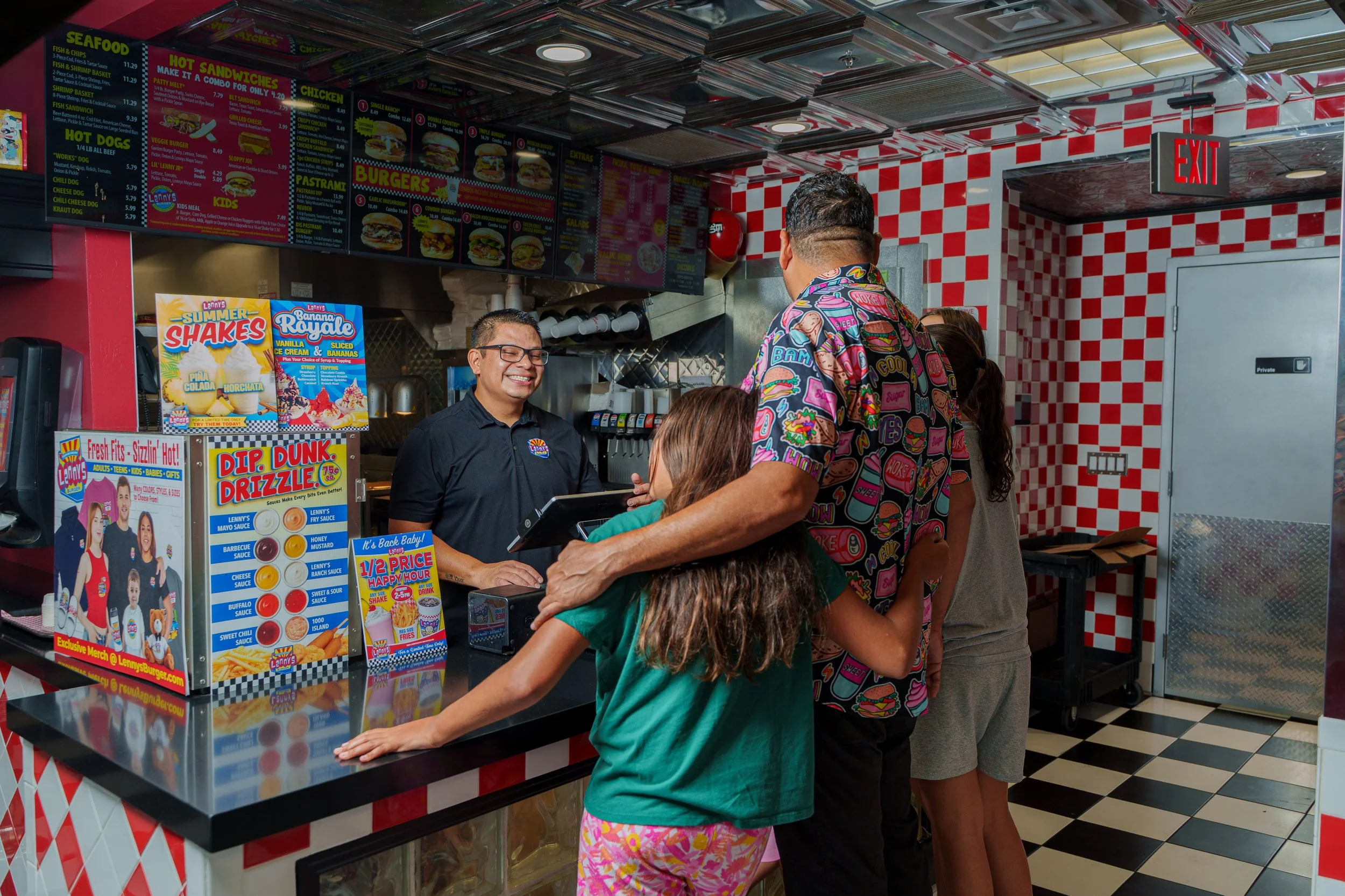 Customers ordering food at the counter inside Lenny's Burger in Phoenix