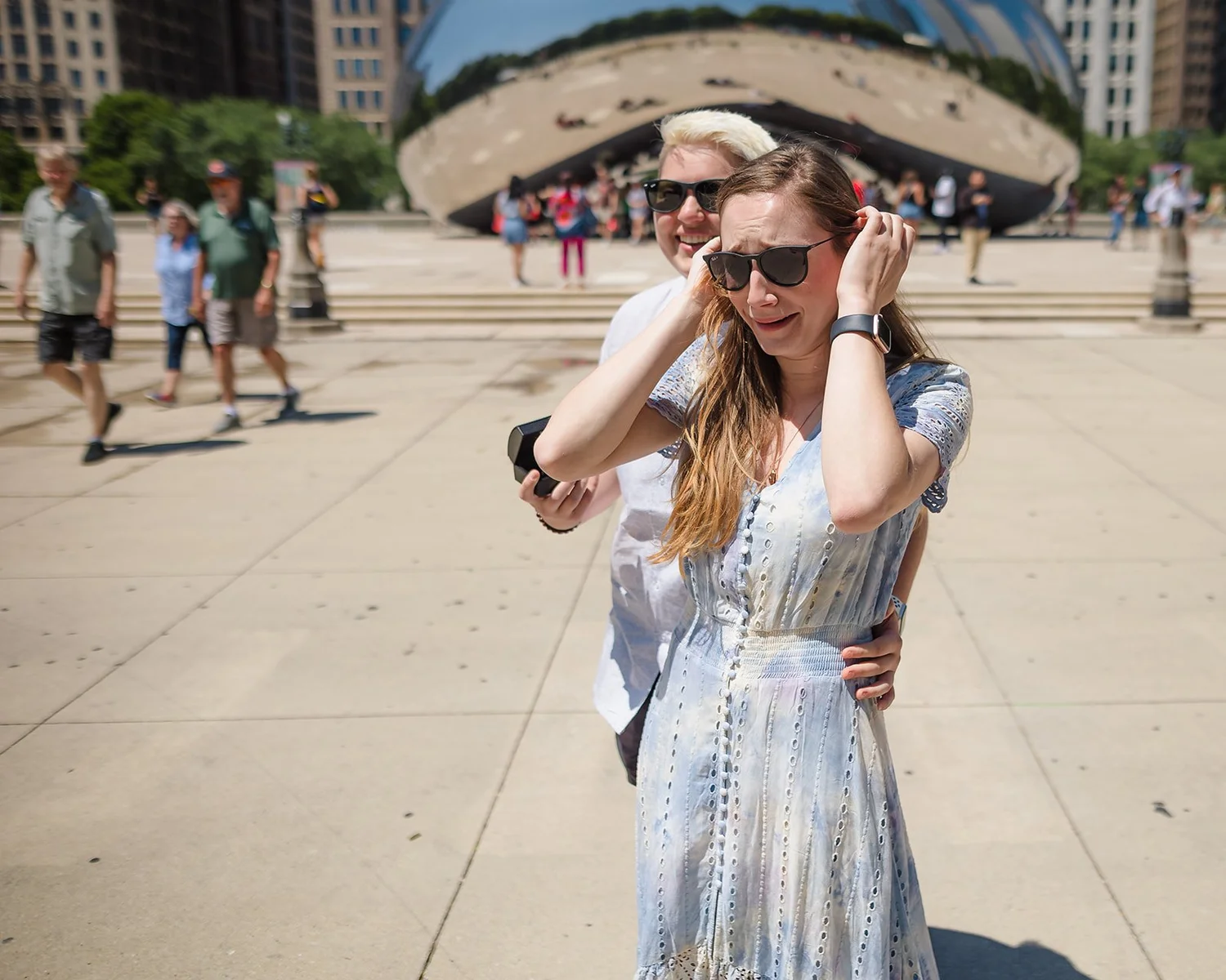 Couple on glass ledge at Willis Tower Skydeck after proposal