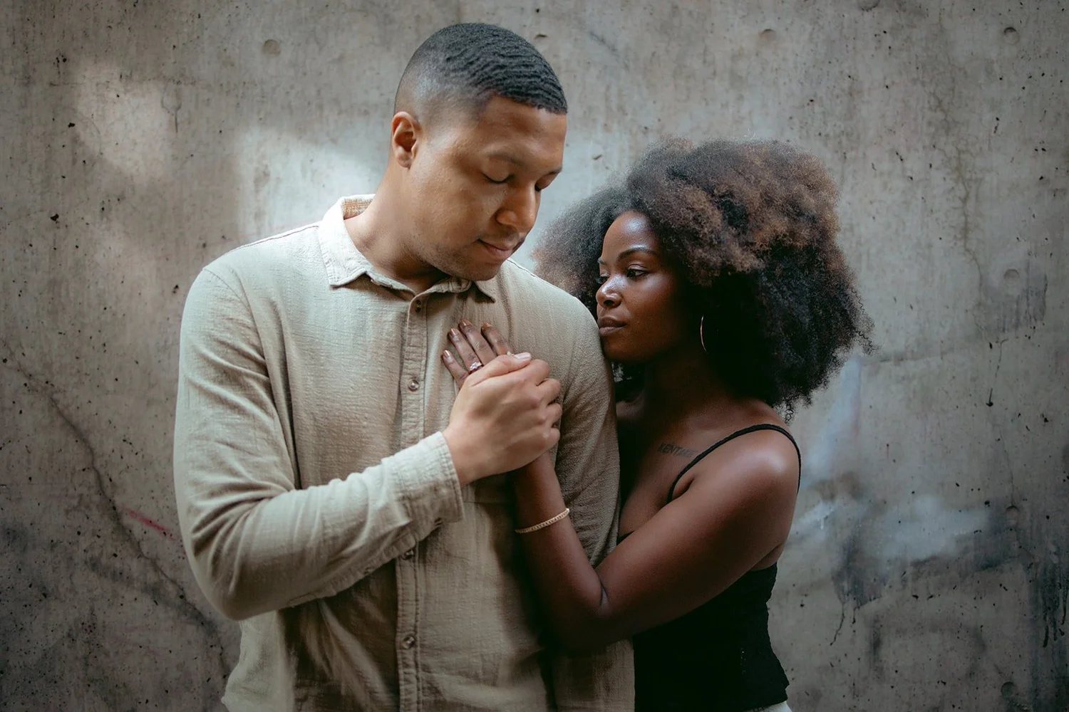 Dramatic silhouette of couple in urban Chicago setting during editorial engagement session