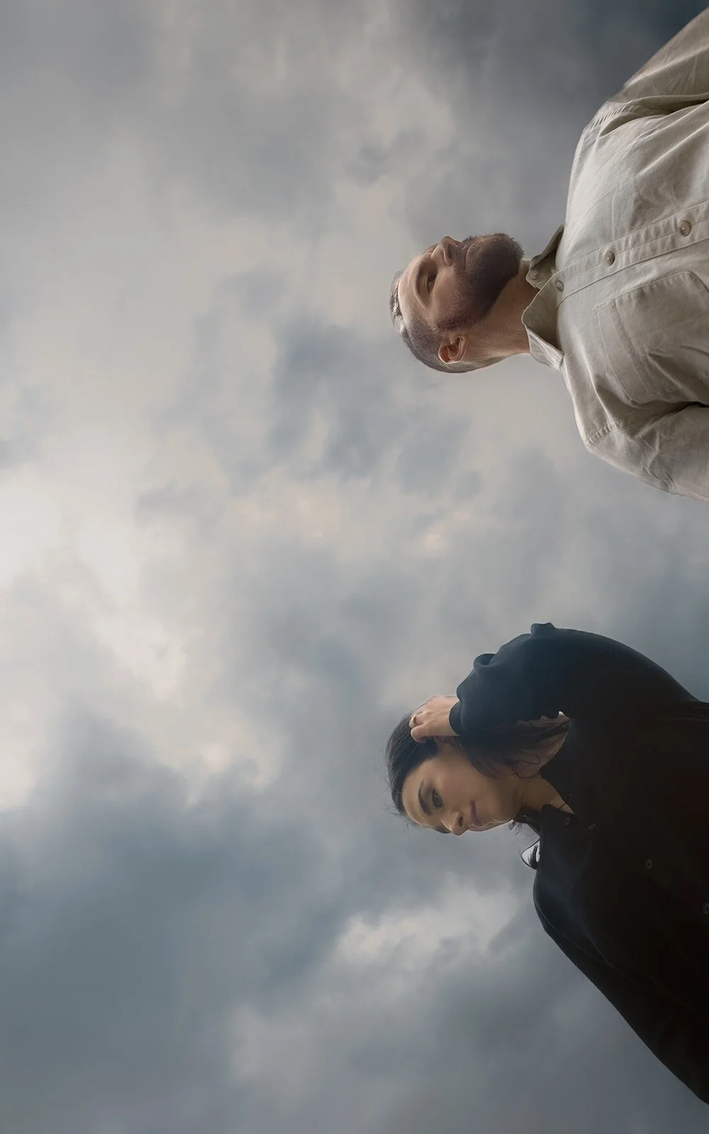 Couple walking together through Ping Tom Memorial Park during engagement photography session