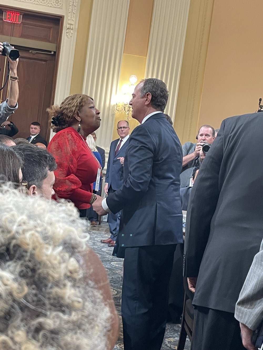 Election worker Ruby Freeman shakes hands with Rep. Adam Schiff at January 6th hearing