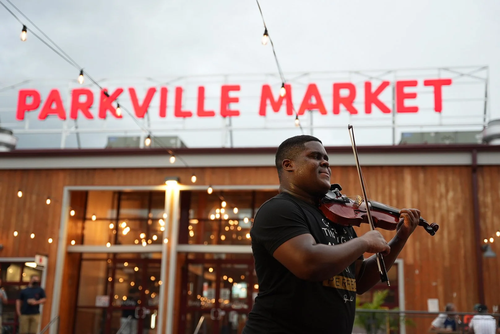 Dr.Violin at Parkville Market in Hartford, CT where he can frequently be found street performing or enjoying one of the many amazing restaurants located there!