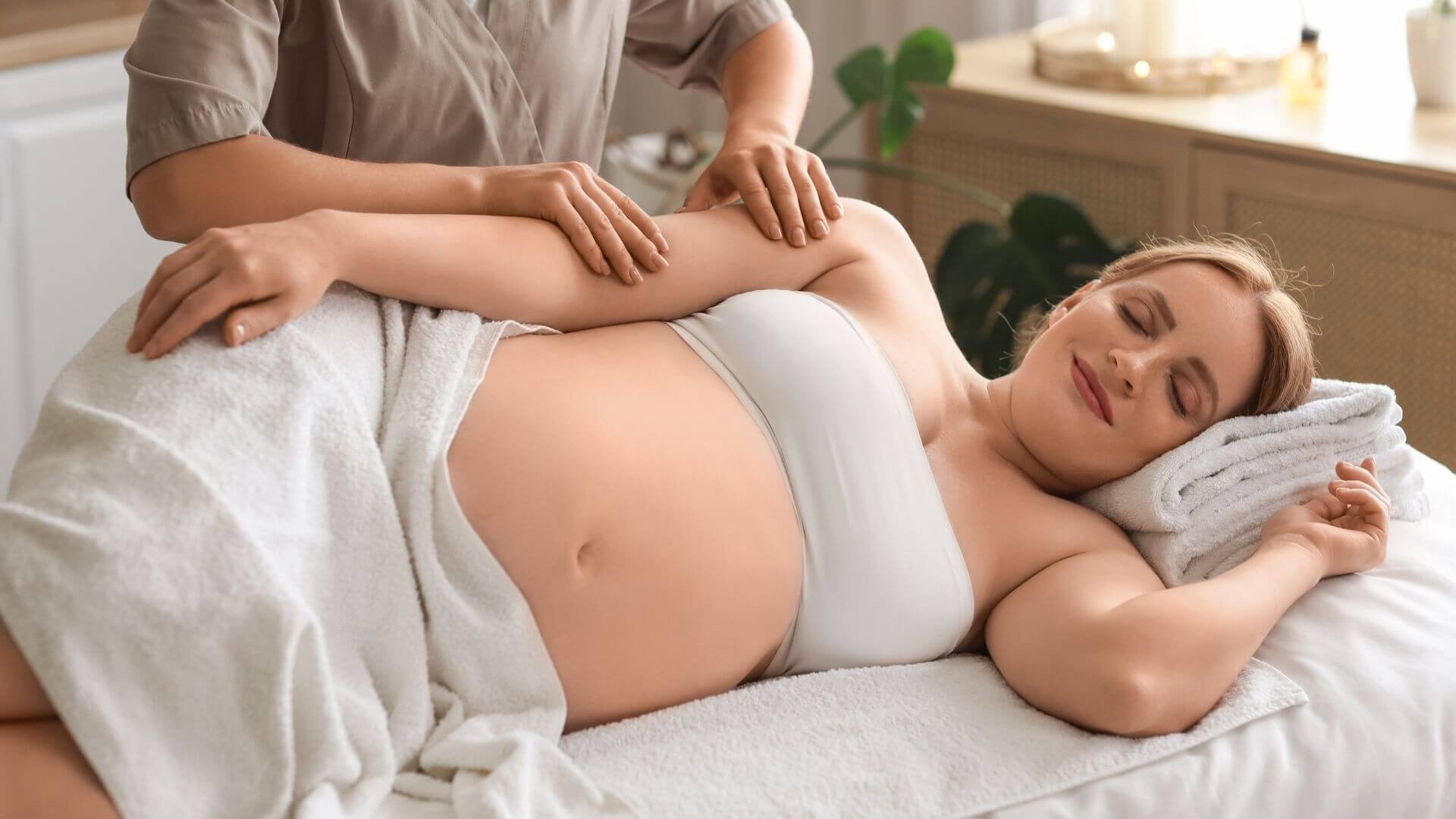 a pregnant woman enjoying a prenatal massage