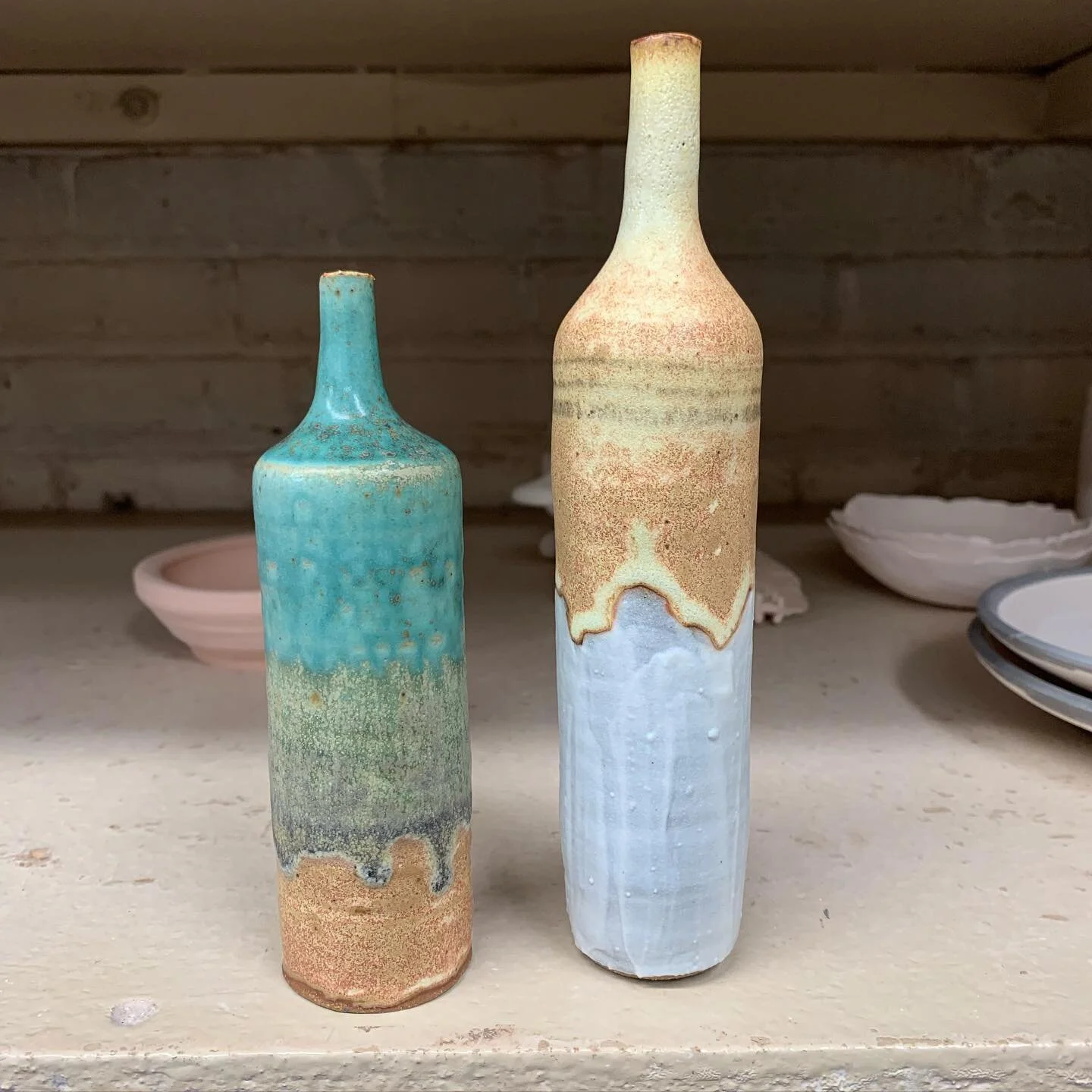 Baby bottles thrown on the wheel and fired to cone ten at GHP.  Swipe left to see them before they went through the gas kiln.