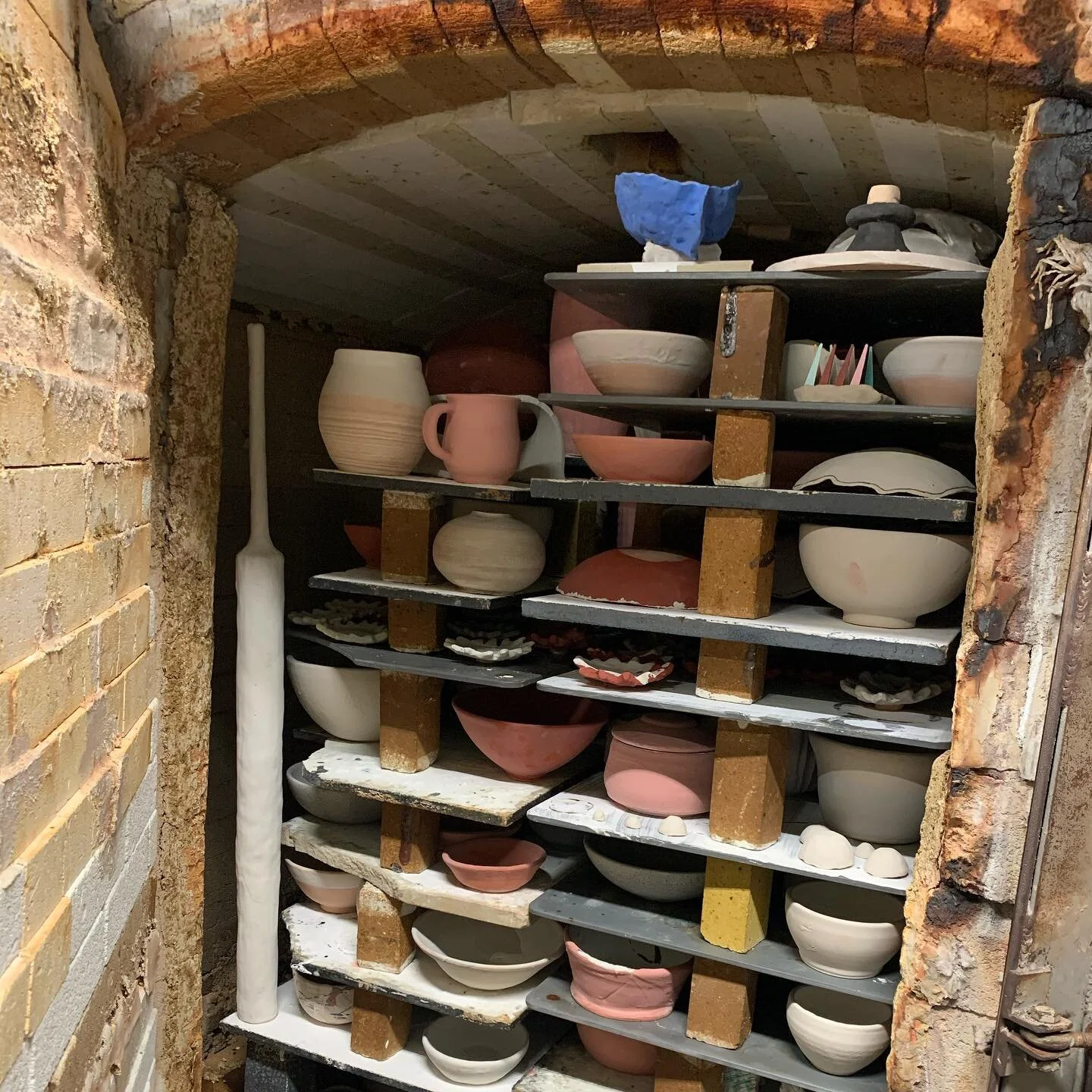 Folks ask how I get the bottles in the kiln and the answer is one at a time.