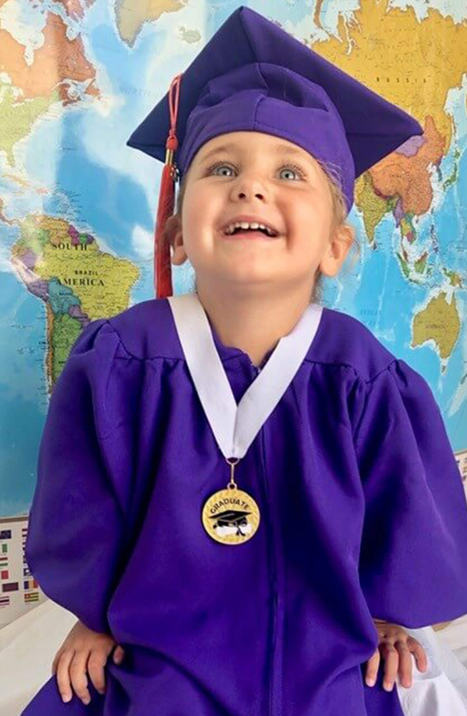 Kindy kids don black gown and caps for graduation | The Courier Mail