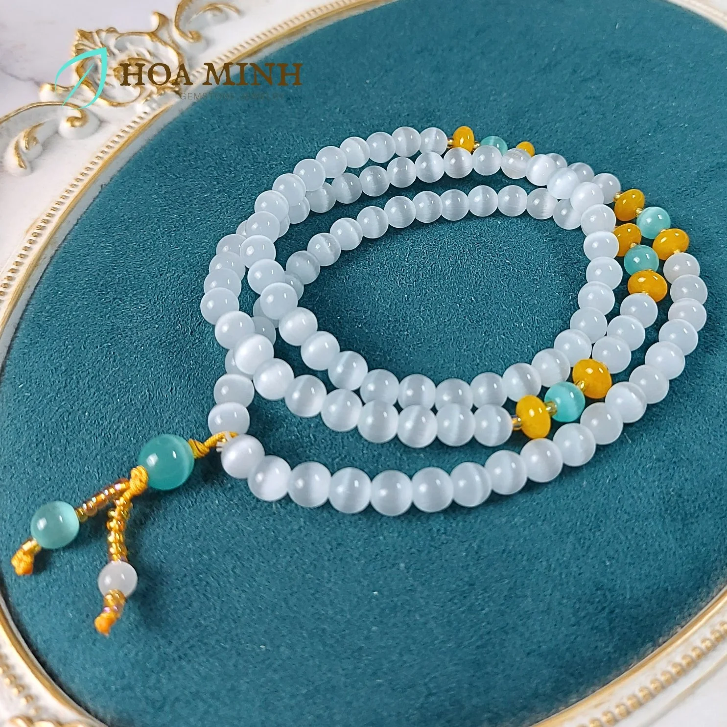 13-vong-tay-da-mat-meo-trang-size-hat-8-li-chuoi-108-hat-phoi-mat-meo-xanh-hat-banh-xe-ma-nao-vang-hoa-minh-gem.jpg