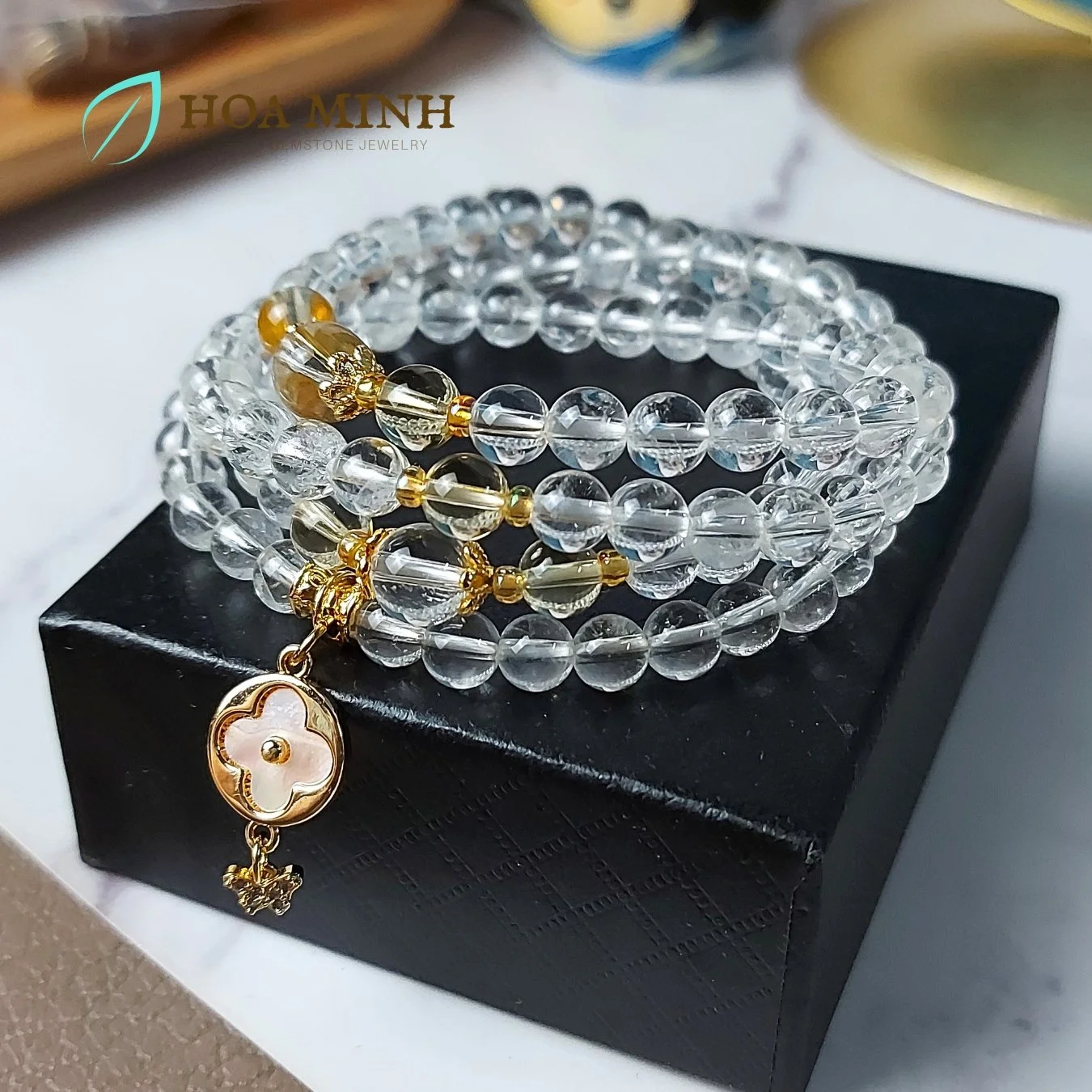 3-vong-chuoi-108-hat-thach-anh-trang-pha-le-size-hat-6-li-phoi-charm-co-4-la-va-buom-nho-dinh-da-op-hoa-thach-anh-vang-hoa-minh-gem.jpg
