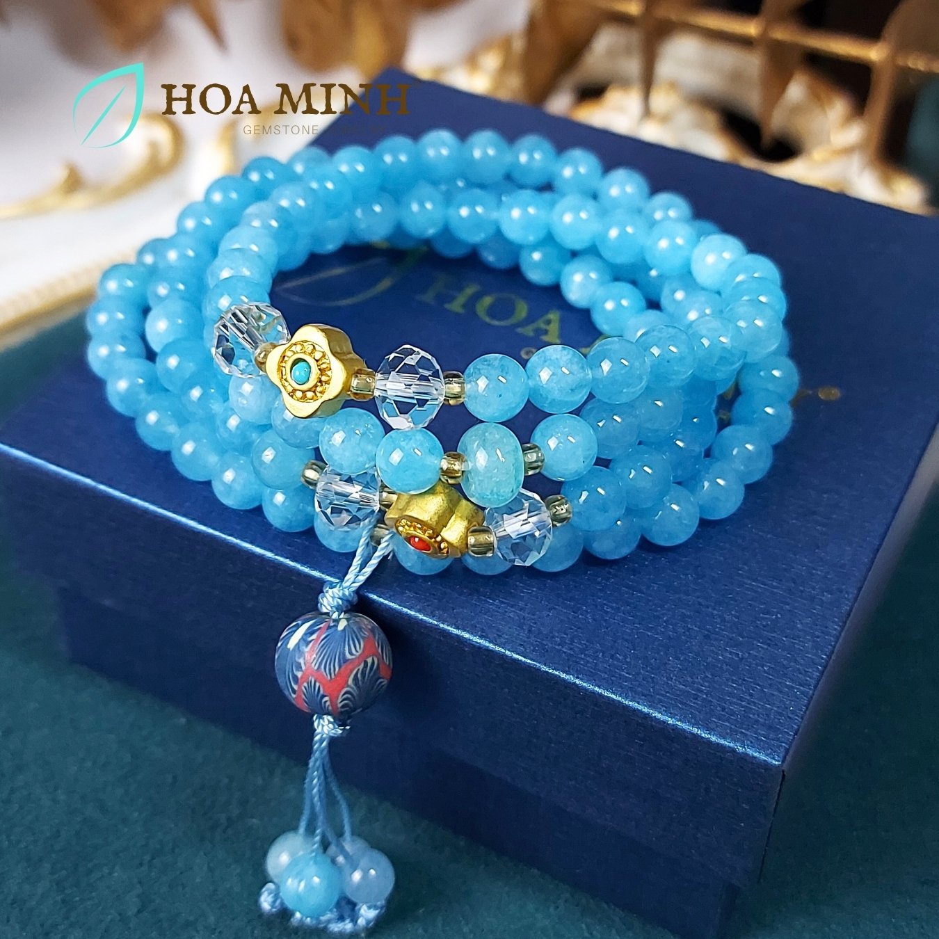 9-vong-tay-108-hat-da-aquamarine-size-6-5-li-phoi-vien-thach-anh-trang-oval-cat-giac-charm-co-4-la-phong-cach-tay-tang-vien-dat-set-hoa-xanh-hoa-minh-gem.jpg