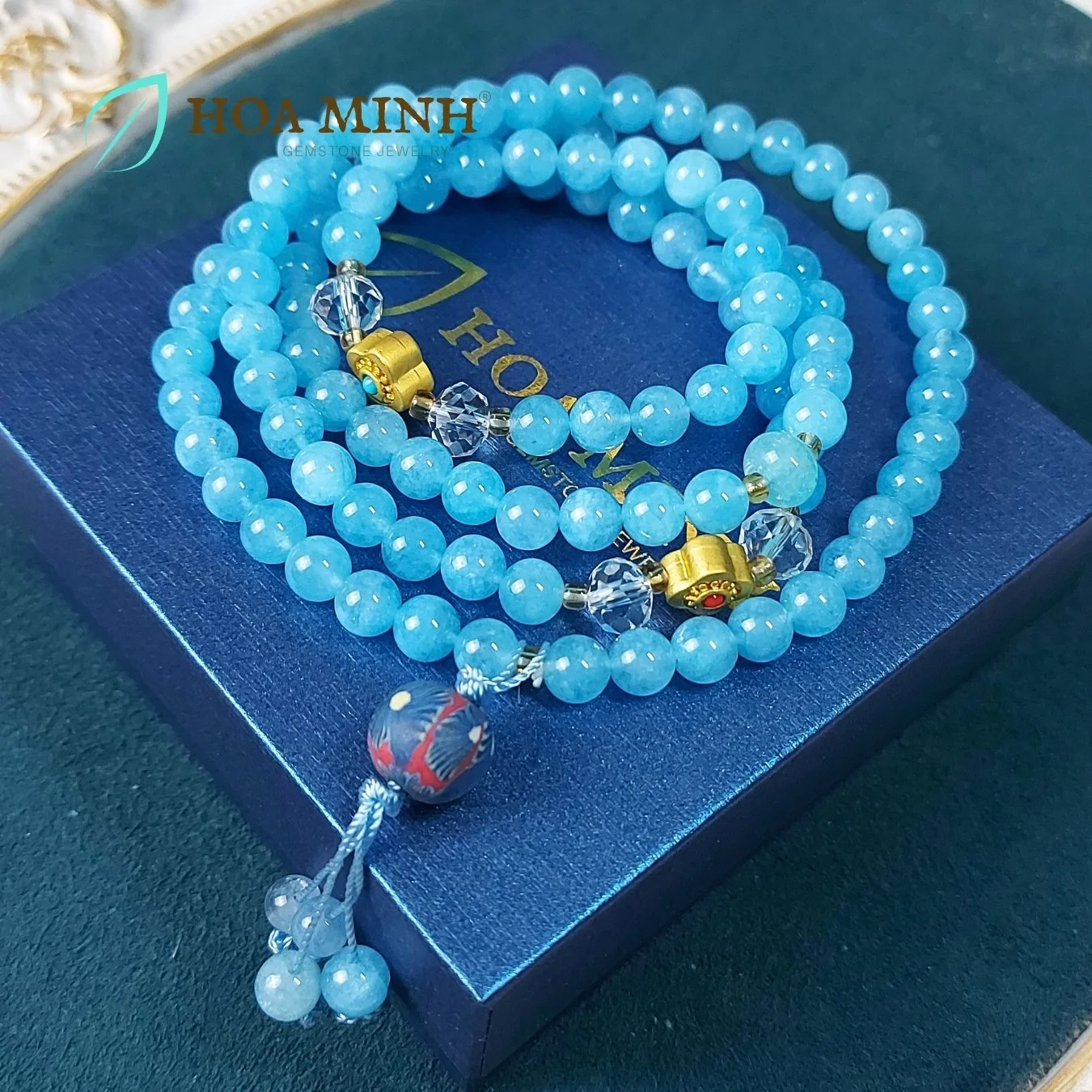 11-vong-tay-108-hat-da-aquamarine-size-6-5-li-phoi-vien-thach-anh-trang-oval-cat-giac-charm-co-4-la-phong-cach-tay-tang-vien-dat-set-hoa-xanh-hoa-minh-gem.jpg