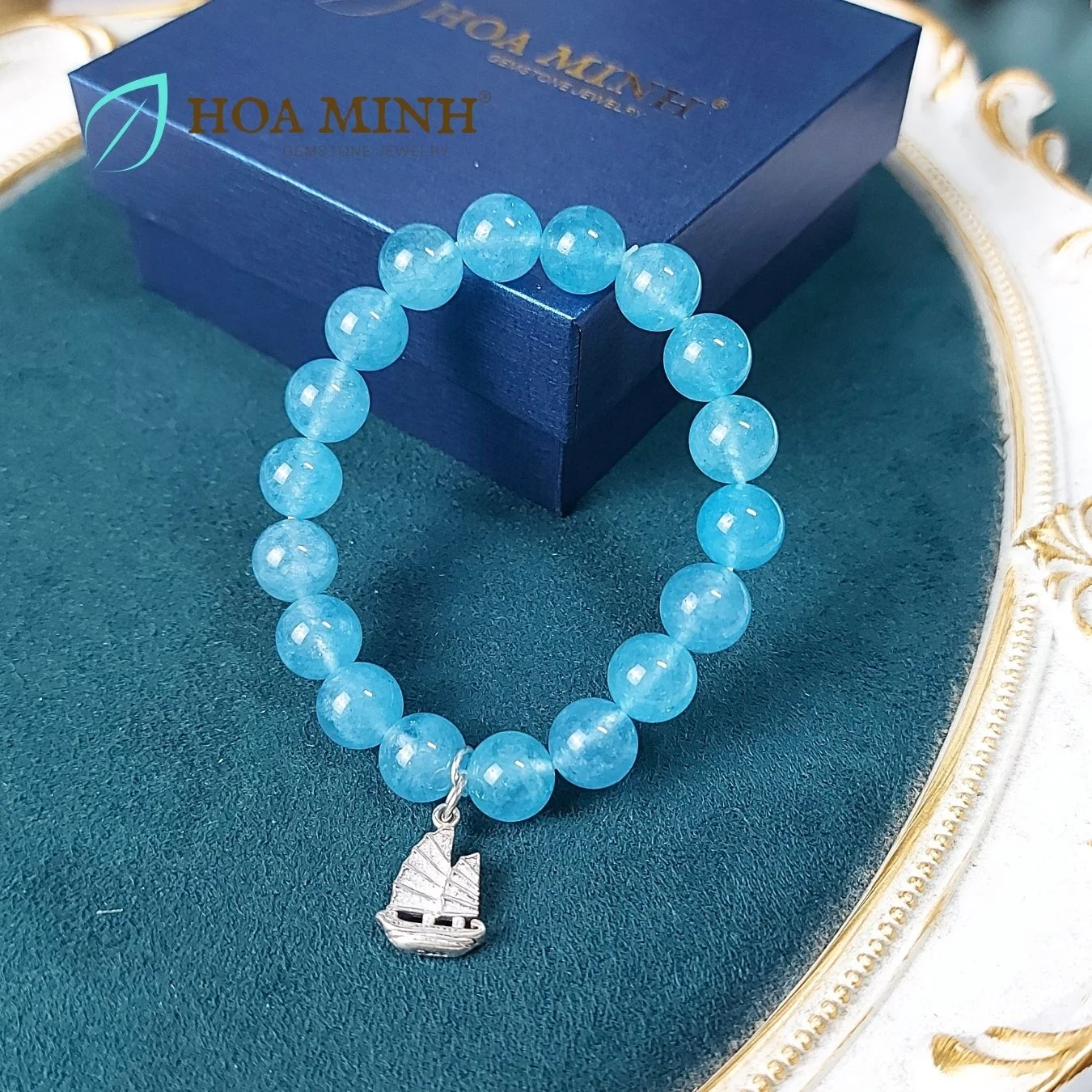 6-vong-tay-da-aquamarine-ngoc-hai-lam-size-hat-10-li-tu-nhien-phoi-charm-bac-treo-kieu-con-thuyen-thuan-buom-xuoi-gio-hoa-minh-gem.jpg