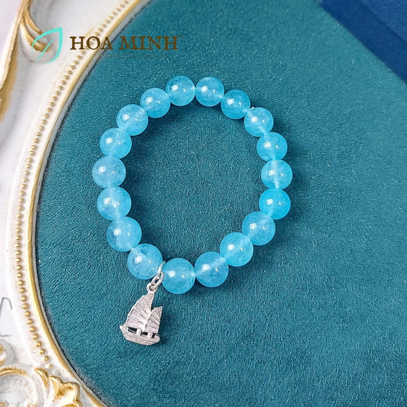 7-vong-tay-da-aquamarine-ngoc-hai-lam-size-hat-10-li-tu-nhien-phoi-charm-bac-treo-kieu-con-thuyen-thuan-buom-xuoi-gio-hoa-minh-gem.jpg
