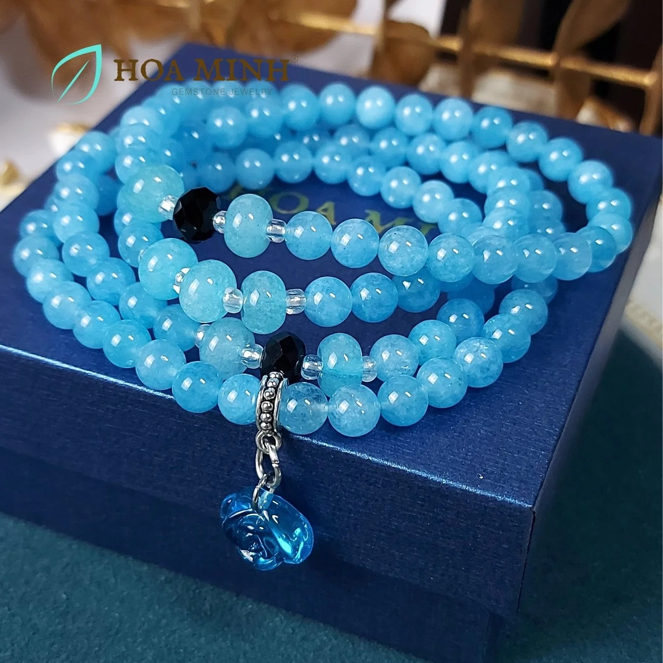 1-vong-chuoi-108-hat-da-aquamarine-size-6-5-li-phoi-vien-banh-xe-ma-nao-den-charm-hoa-hong-xanh-tinh-khoi-phong-thuy-binh-an-hoa-minh-gem.jpg