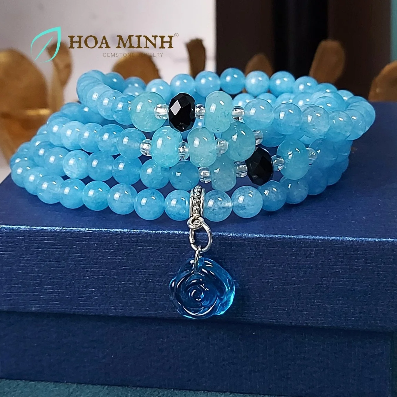 8-vong-chuoi-108-hat-da-aquamarine-size-6-5-li-phoi-vien-banh-xe-ma-nao-den-charm-hoa-hong-xanh-tinh-khoi-phong-thuy-binh-an-hoa-minh-gem.jpg