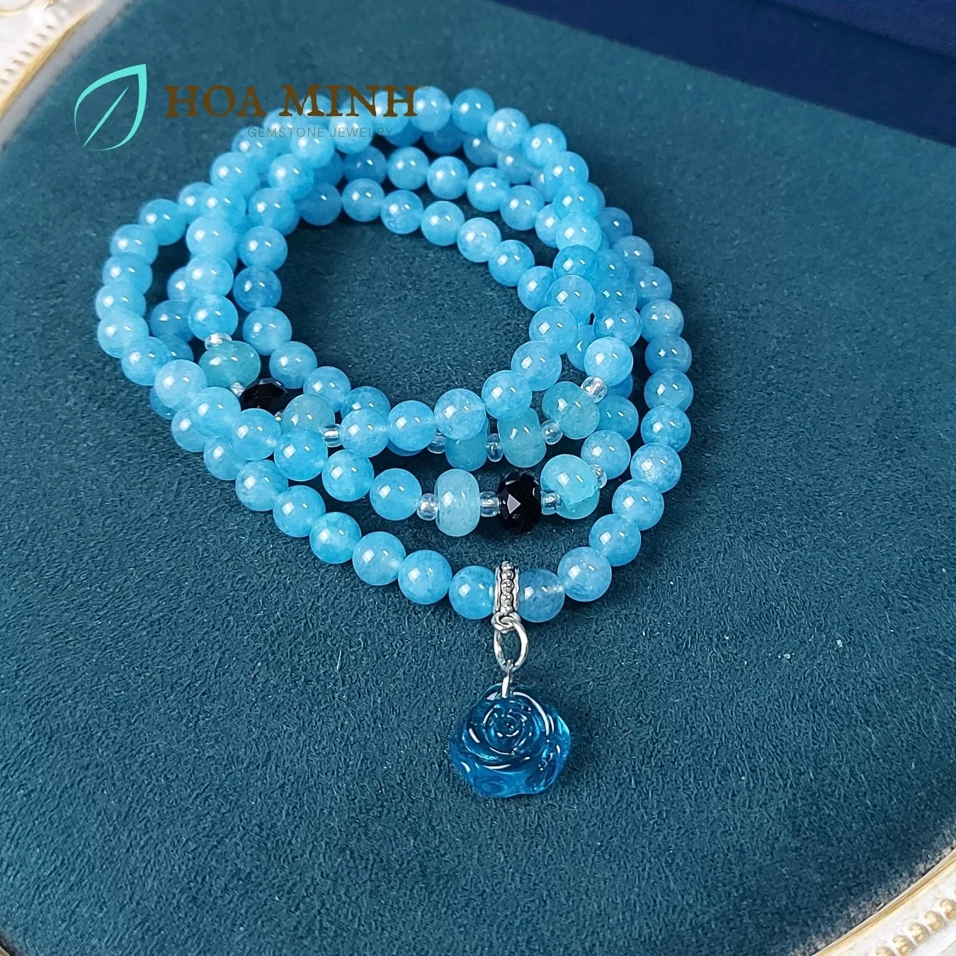 15-vong-chuoi-108-hat-da-aquamarine-size-6-5-li-phoi-vien-banh-xe-ma-nao-den-charm-hoa-hong-xanh-tinh-khoi-phong-thuy-binh-an-hoa-minh-gem.jpg