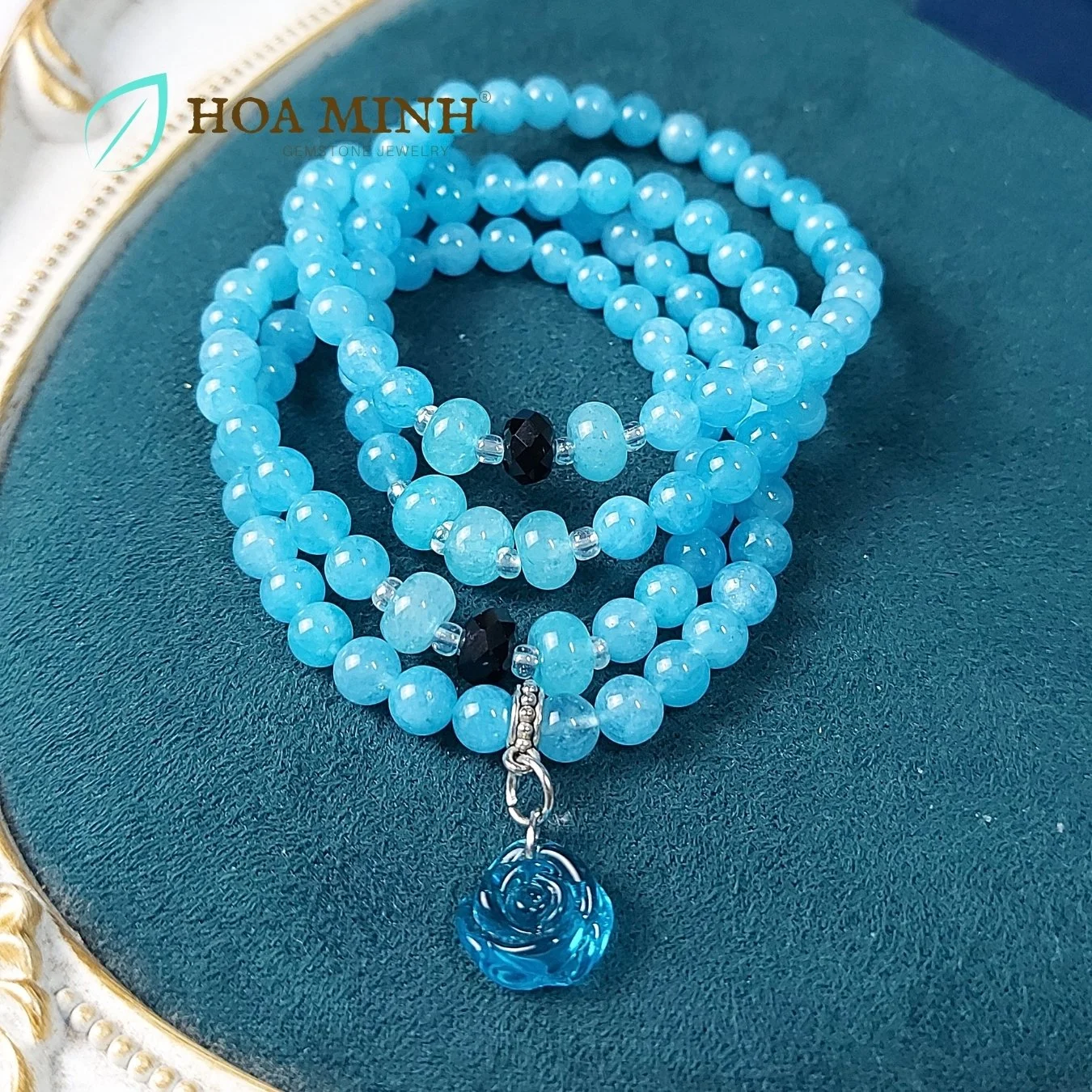 16-vong-chuoi-108-hat-da-aquamarine-size-6-5-li-phoi-vien-banh-xe-ma-nao-den-charm-hoa-hong-xanh-tinh-khoi-phong-thuy-binh-an-hoa-minh-gem.jpg