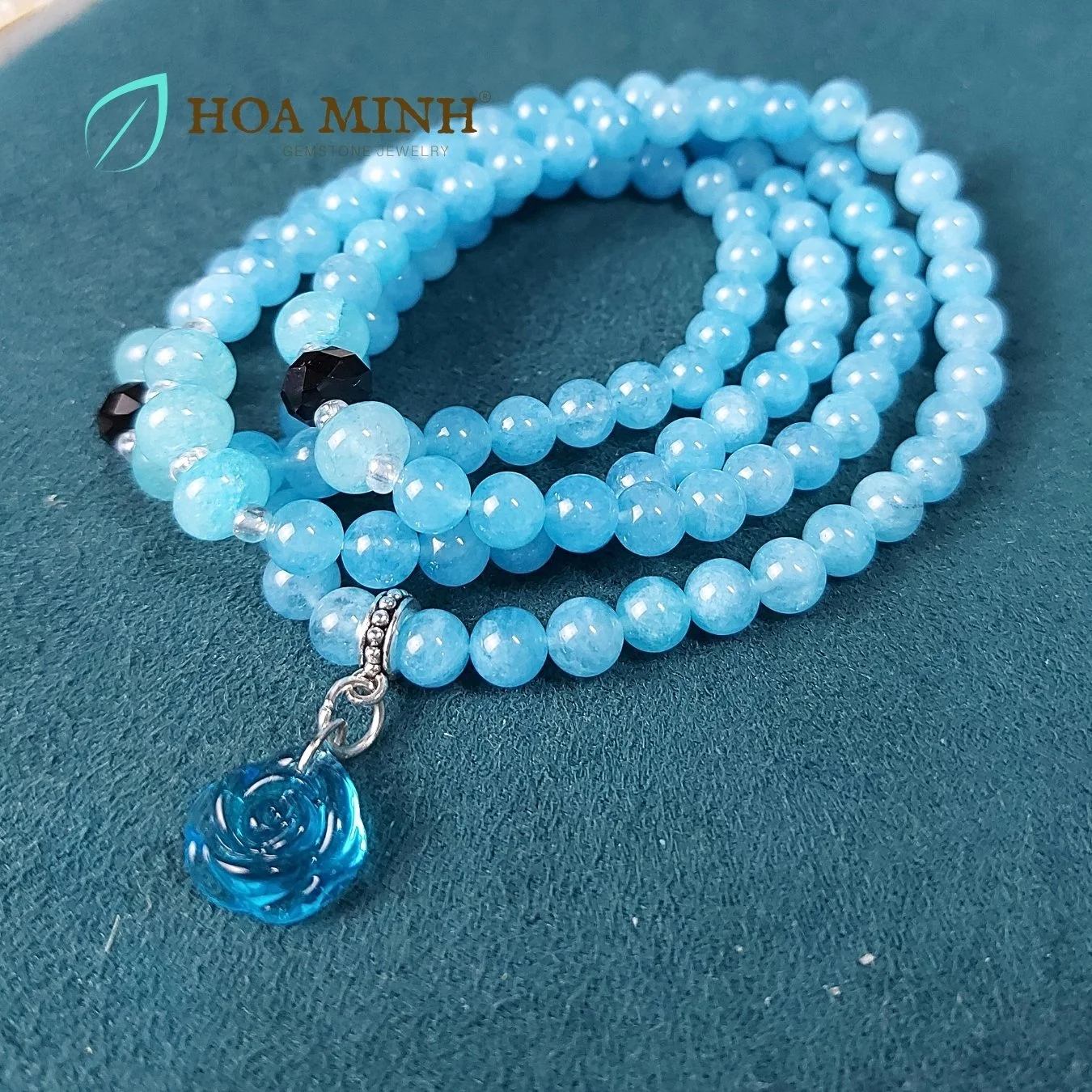 17-vong-chuoi-108-hat-da-aquamarine-size-6-5-li-phoi-vien-banh-xe-ma-nao-den-charm-hoa-hong-xanh-tinh-khoi-phong-thuy-binh-an-hoa-minh-gem.jpg