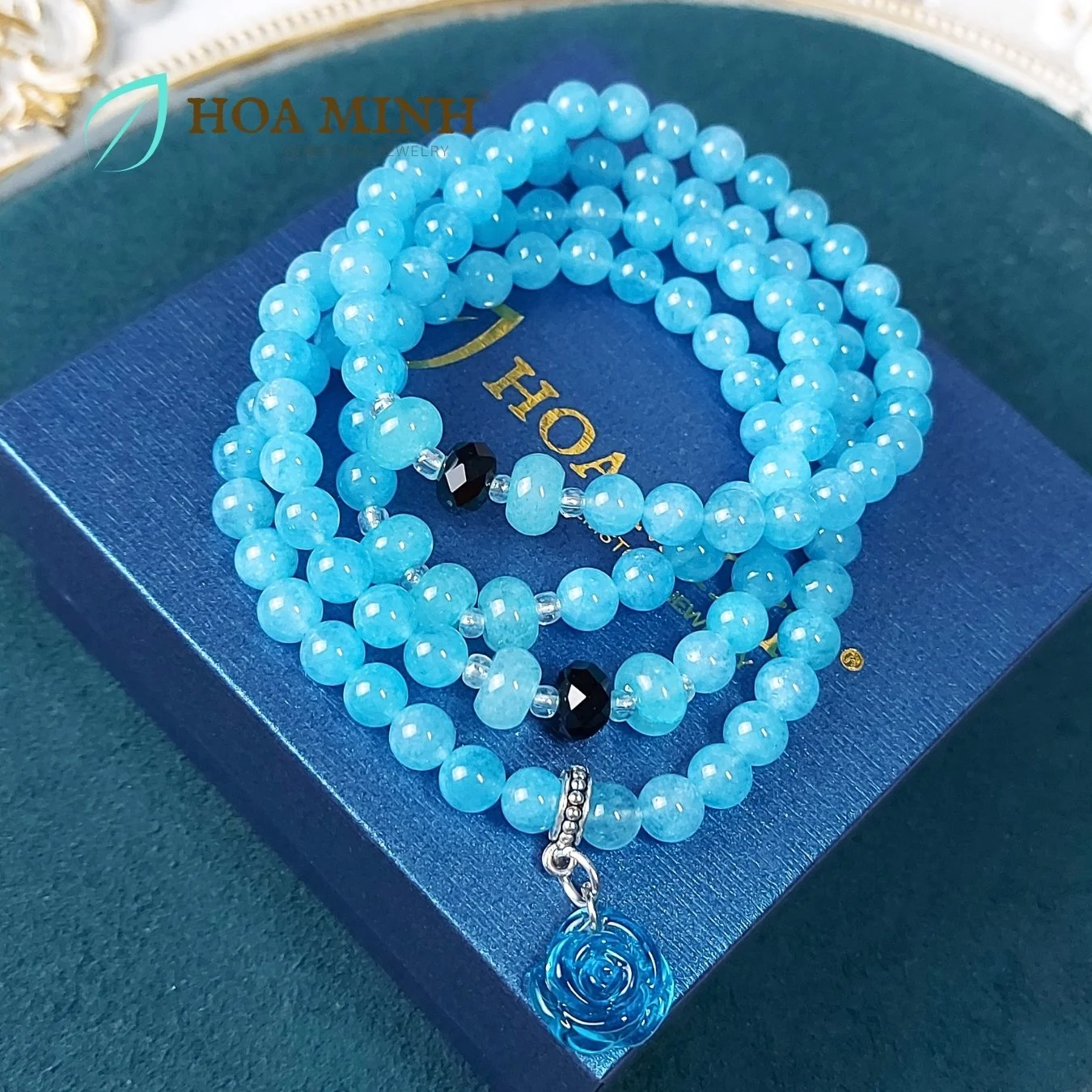 18-vong-chuoi-108-hat-da-aquamarine-size-6-5-li-phoi-vien-banh-xe-ma-nao-den-charm-hoa-hong-xanh-tinh-khoi-phong-thuy-binh-an-hoa-minh-gem.jpg