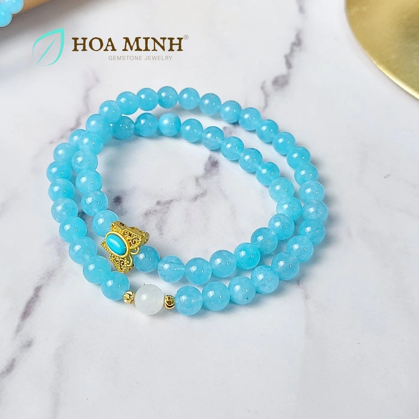 9-vong-tay-quan-2-da-aquamarine-size-6-5-li-phoi-vien-ma-nao-trang-va-bi-cat-giac-charm-buom-ho-diep-xinh-xan-thoi-trang-hoa-minh-gem.jpg
