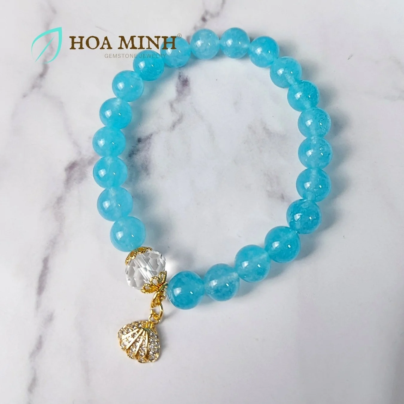 10-vong-tay-ngoc-hai-lam-aquamarine-8-li-phoi-vien-thach-anh-trang-oval-cat-giac-op-hoa-charm-treo-so-dinh-da-hoa-minh-gem.jpg