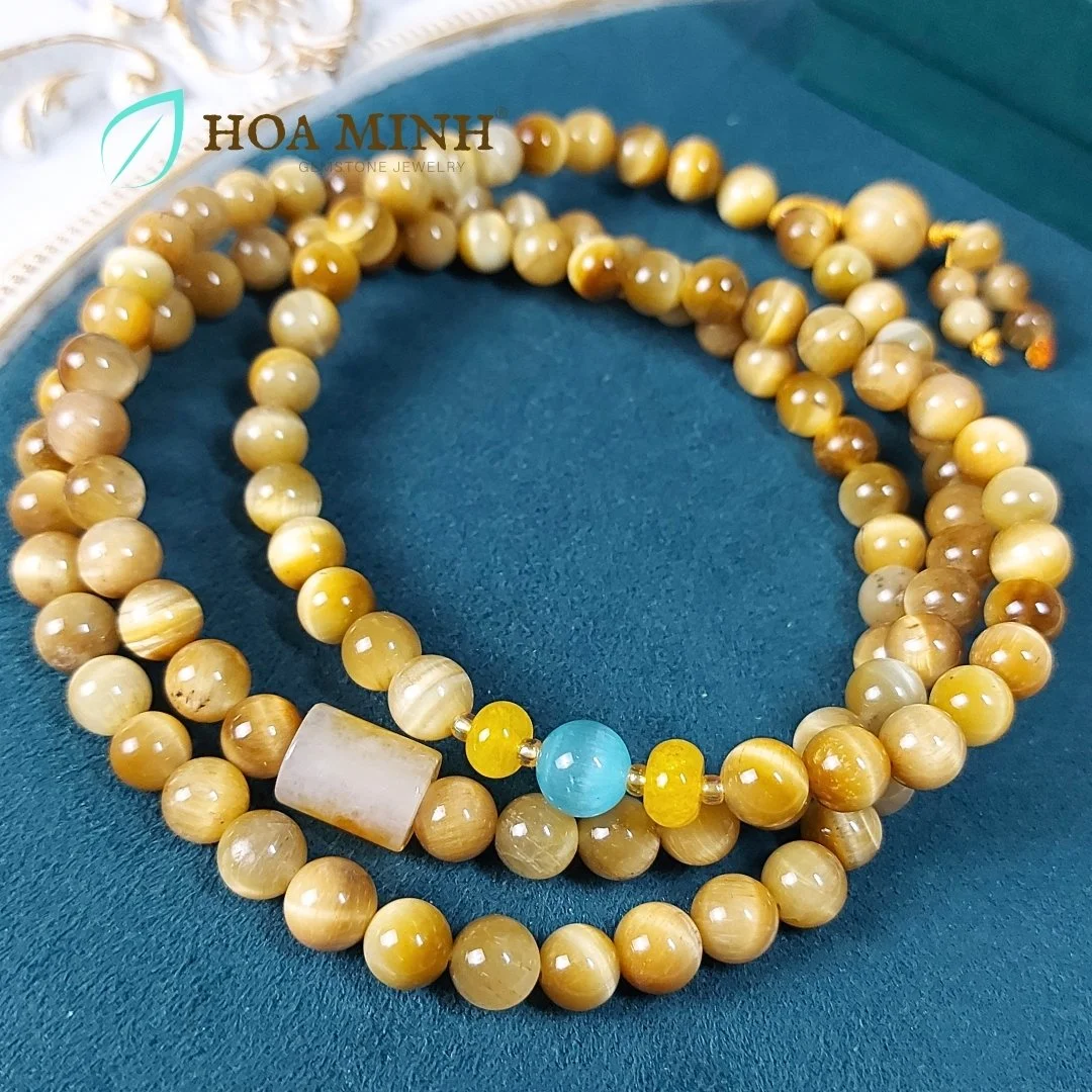 2-chuoi-108-hat-da-mat-ho-vang-tam-size-hat-8-3-li-phoi-lu-thong-ma-nao-vang-banh-xe-ma-nao-da-mat-meo-phong-cach-binh-an-may-man-hoa-minh-gem.jpg