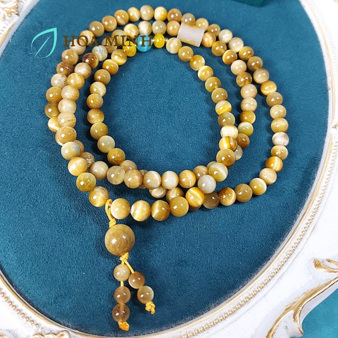 3-chuoi-108-hat-da-mat-ho-vang-tam-size-hat-8-3-li-phoi-lu-thong-ma-nao-vang-banh-xe-ma-nao-da-mat-meo-phong-cach-binh-an-may-man-hoa-minh-gem.jpg