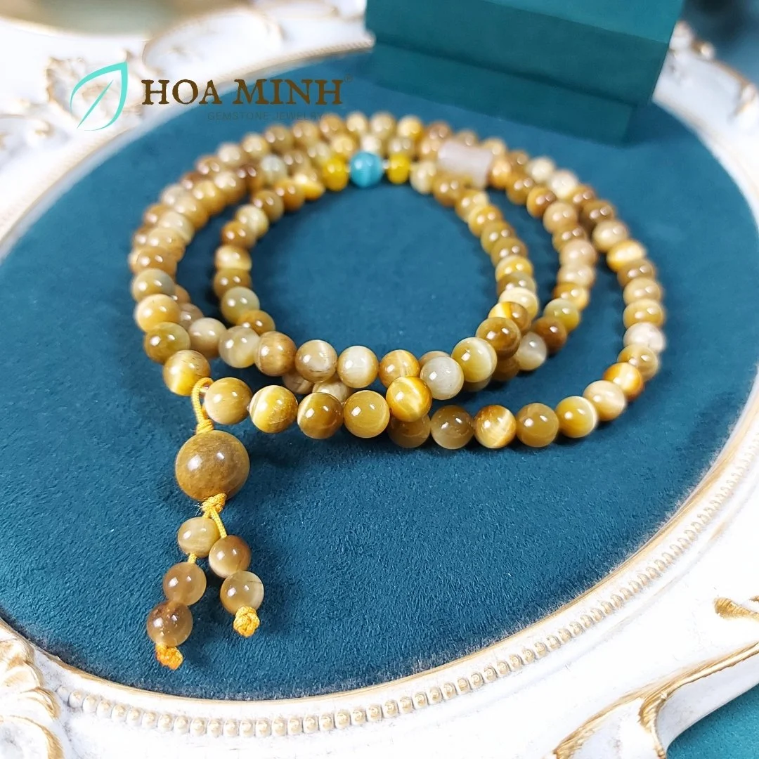 8-chuoi-108-hat-da-mat-ho-vang-tam-size-hat-8-3-li-phoi-lu-thong-ma-nao-vang-banh-xe-ma-nao-da-mat-meo-phong-cach-binh-an-may-man-hoa-minh-gem.jpg