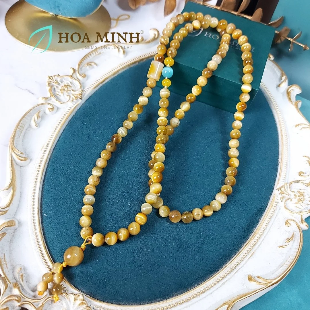 12-chuoi-108-hat-da-mat-ho-vang-tam-size-hat-8-3-li-phoi-lu-thong-ma-nao-vang-banh-xe-ma-nao-da-mat-meo-phong-cach-binh-an-may-man-hoa-minh-gem.jpg