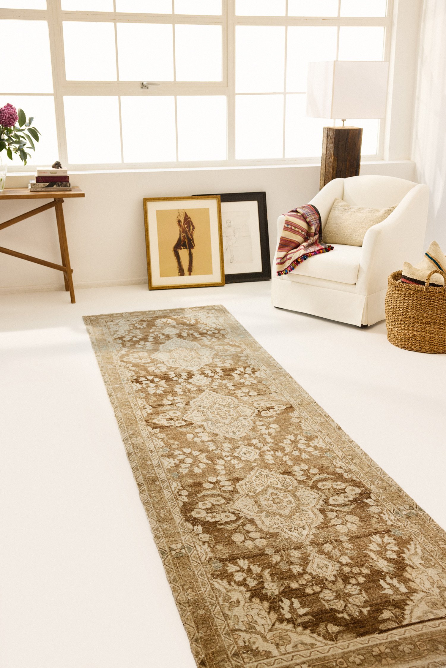 Lifestyle image of vintage Persian Malayer runner in gallery hallway setting