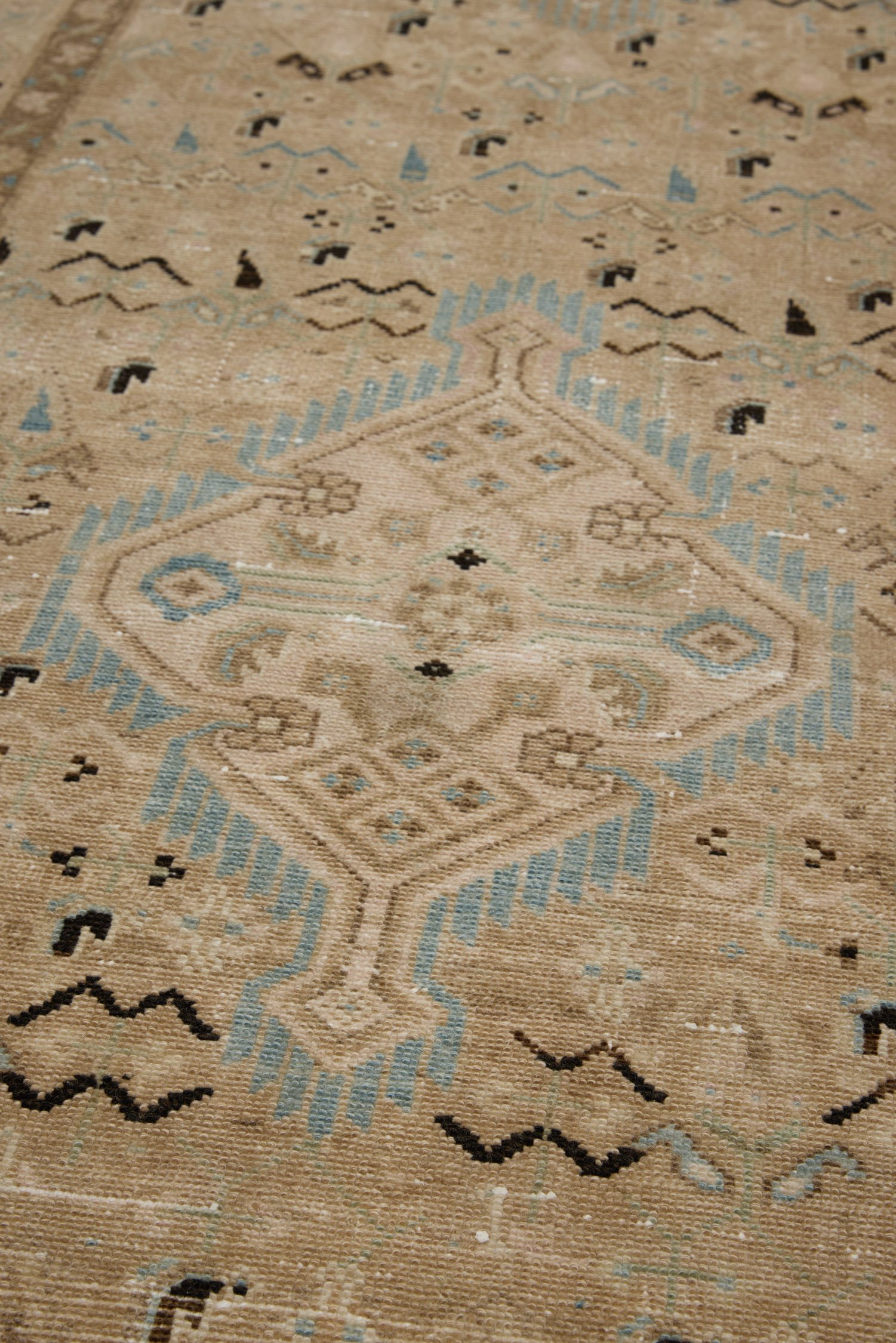 Close up detail of medallions with tribal motifs