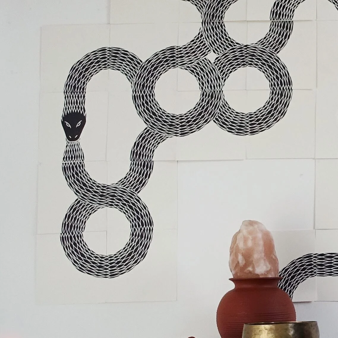 6_9 :
The Ouroboros is an ancient eternity symbol. The serpent biting its own tail has no beginning and no end. The mid century unglazed German vase is part of a large collection I accumulated over the years. I love looking for them in markets and ca