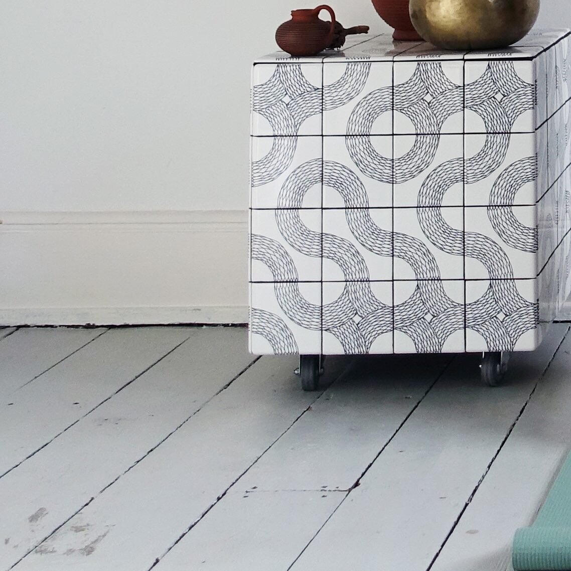 3_9 :
This is my other Ouroboros tile cabinet sample. The round edge tiles on the sides create a smoothness to the eye and hand. It currently is home to my sound bowl and salt lamp.