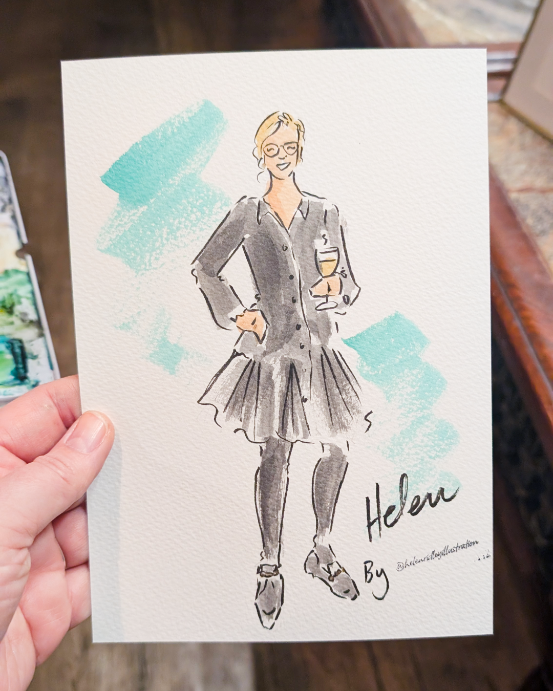 Hand painted water-colour illustration of a lady holding wine and wearing black dress by Illustrator Helen Ridley