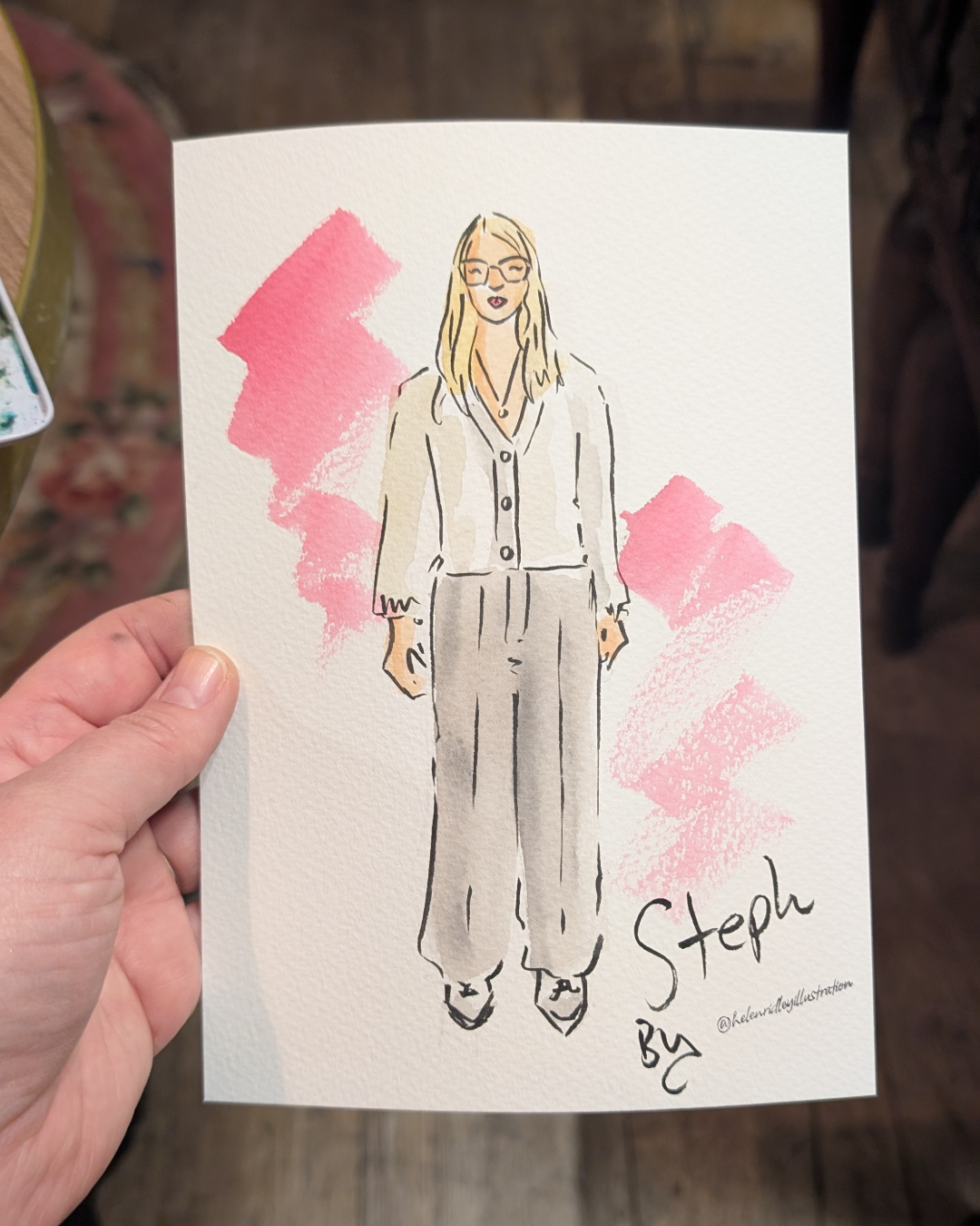 Custom watercolour portrait of lady with blonde hair wearing workwear and was live illustrated by Helen Ridley
