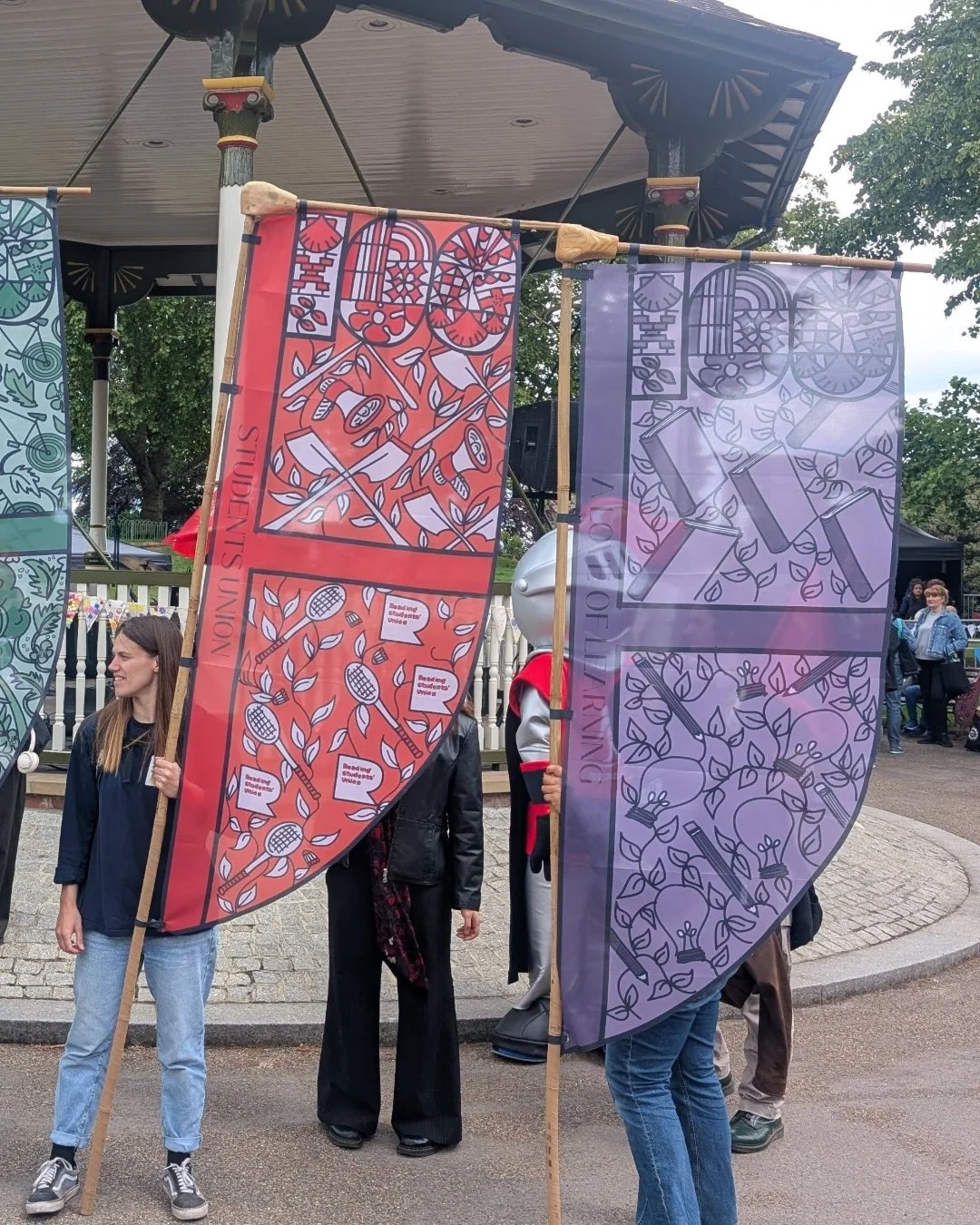 Red and purple reading university centenary flags illustrated by Helen Ridley